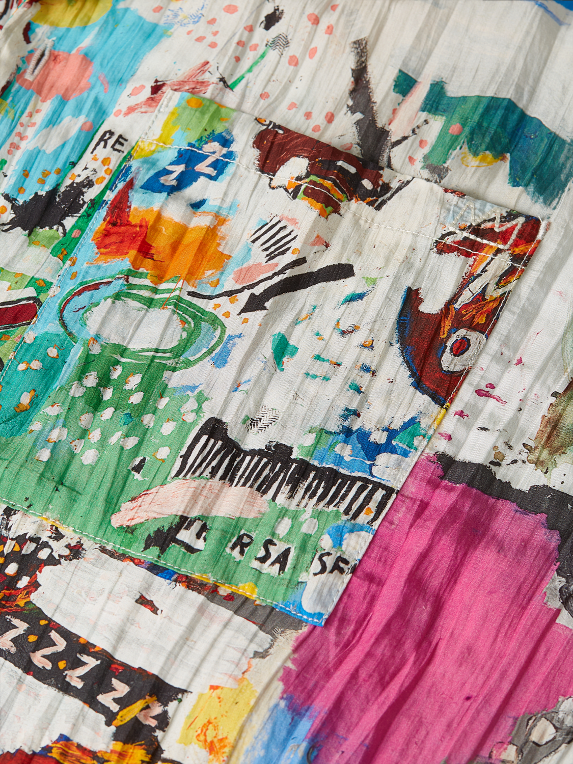 Short-sleeved shirt by Scotch & Soda featuring a bold Basquiat print, casual fit, and vibrant graphic design.