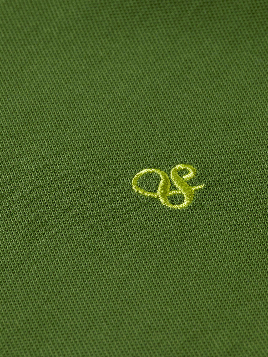 Scotch & Soda logo pique polo shirt featuring a classic collar and short sleeves, made of textured cotton fabric.