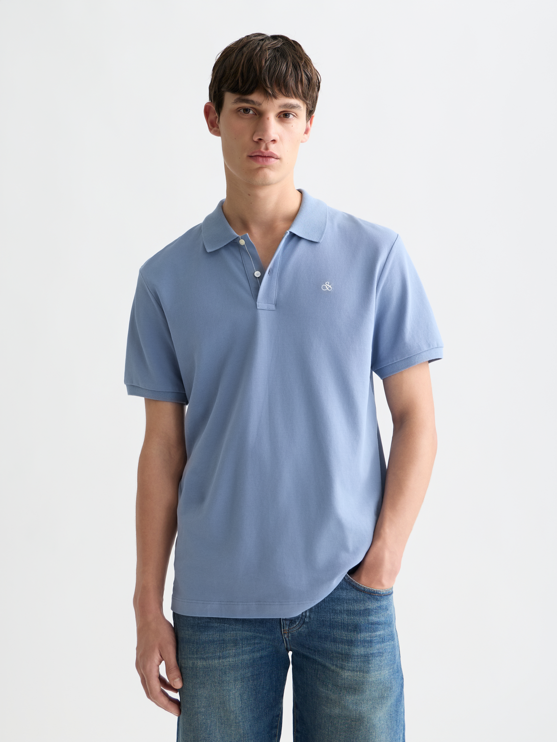 Scotch & Soda logo pique polo shirt in navy with classic collar and short sleeves, displayed flat for product showcase.