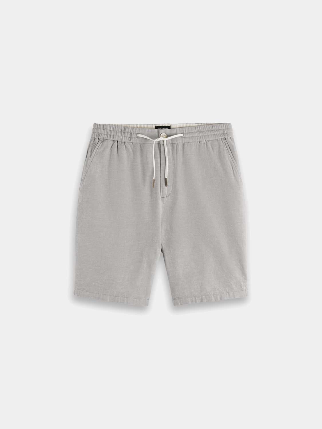 Light beige cotton-linen shorts from SCOTCH & SODA with a relaxed fit and adjustable waistband, shown on a model.