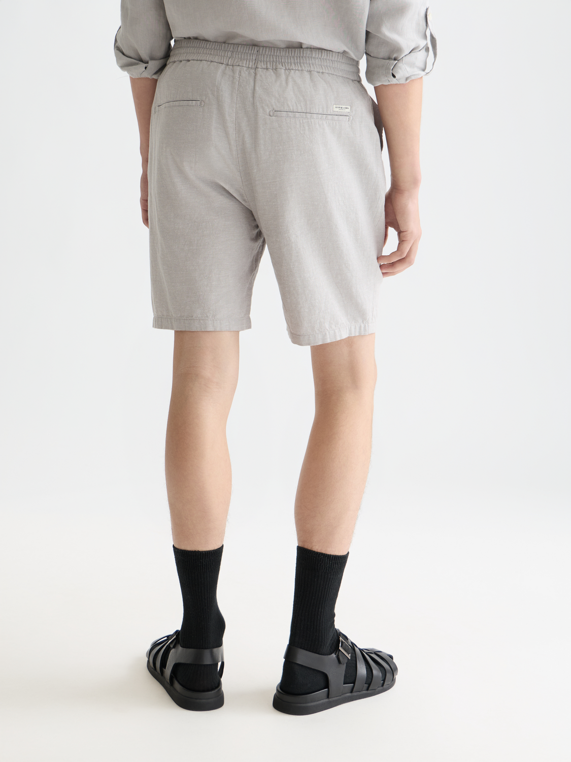 SCOTCH & SODA Fave cotton-linen shorts shown from the back with a relaxed fit and light fabric in a natural color.