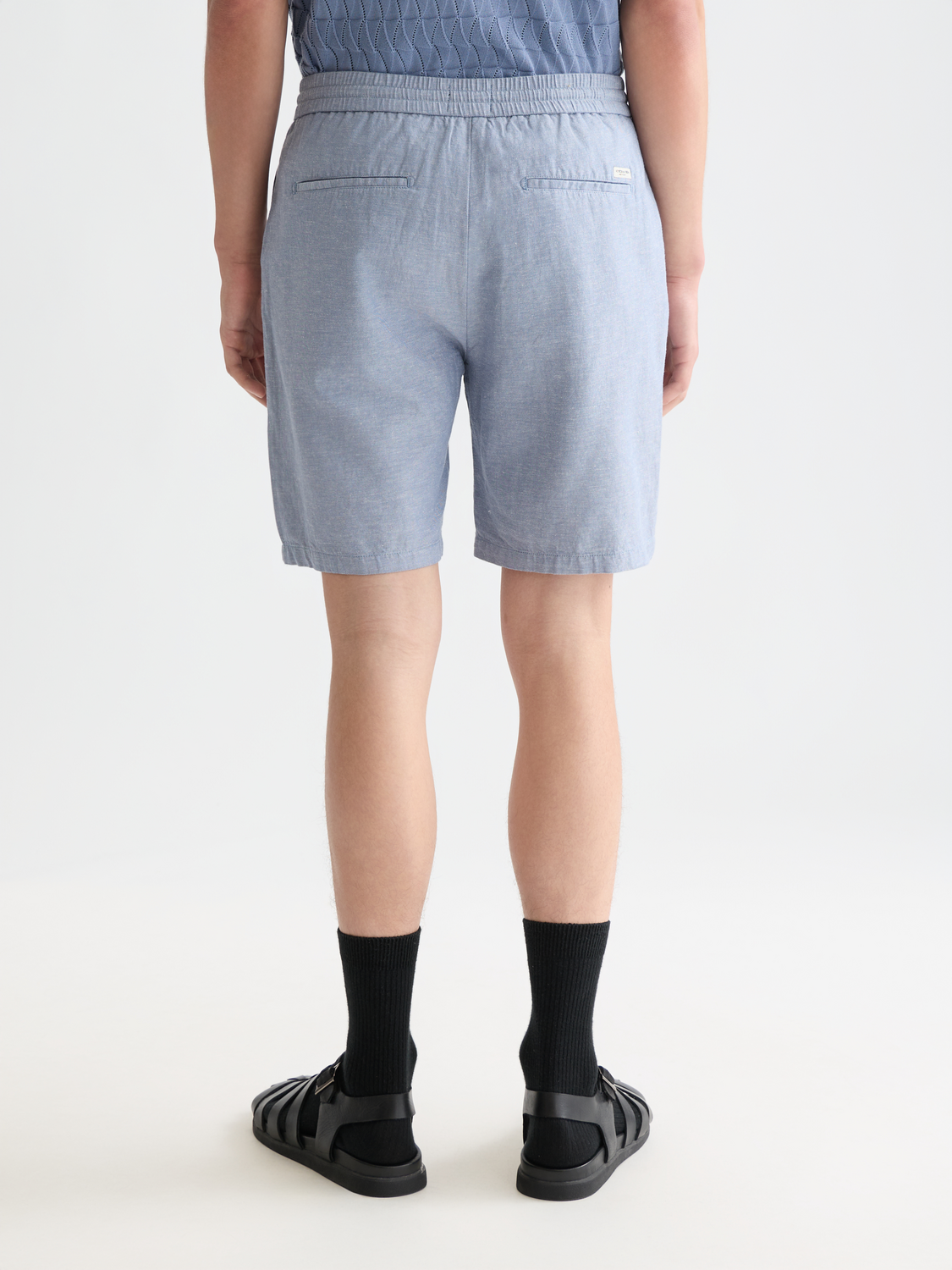 SCOTCH & SODA Fave cotton-linen shorts in natural beige, showing the back view with a relaxed fit and subtle stitching details.