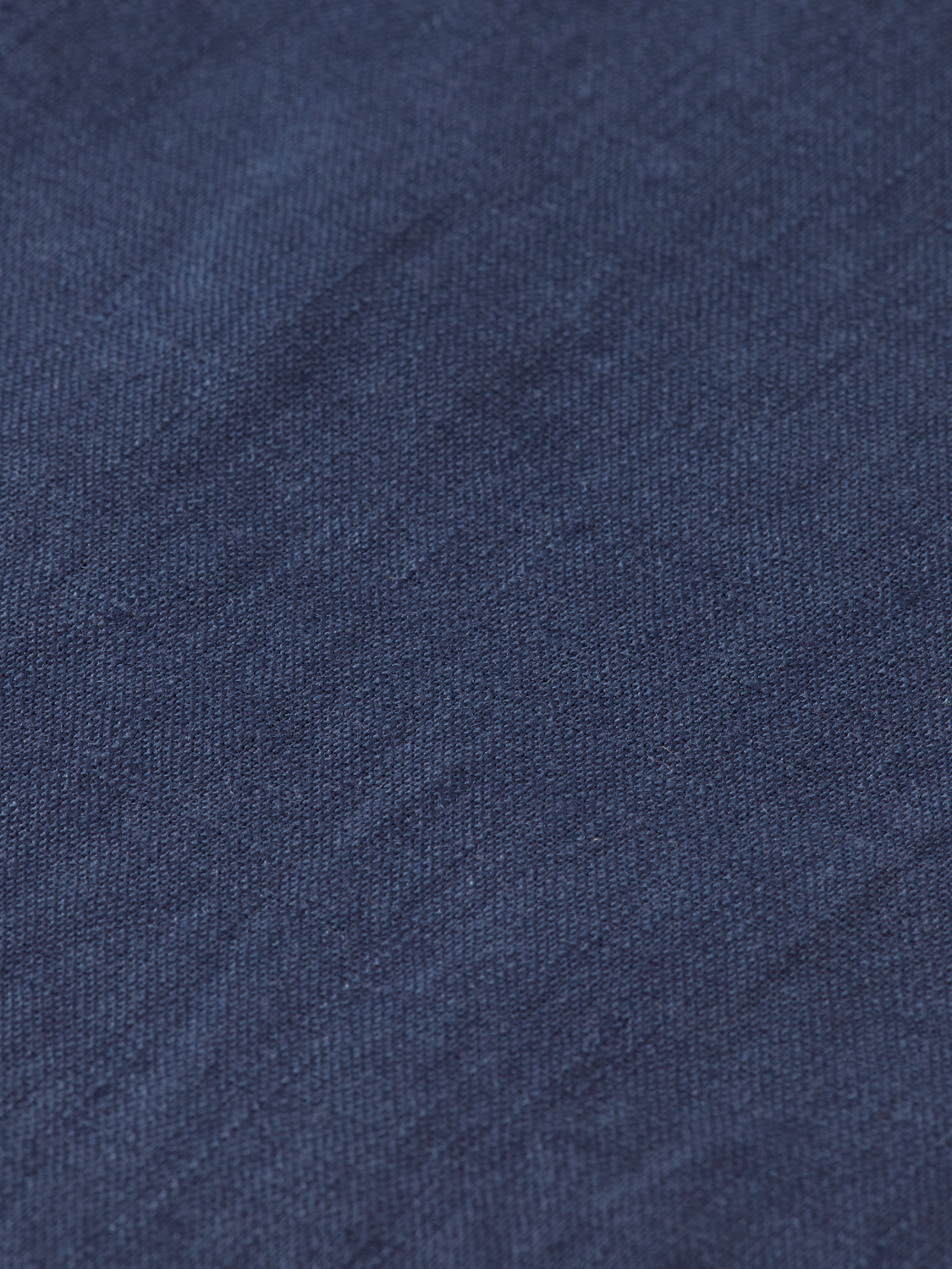 Long-sleeve linen shirt by Scotch & Soda, shown on a hanger with a relaxed fit and natural linen fabric.