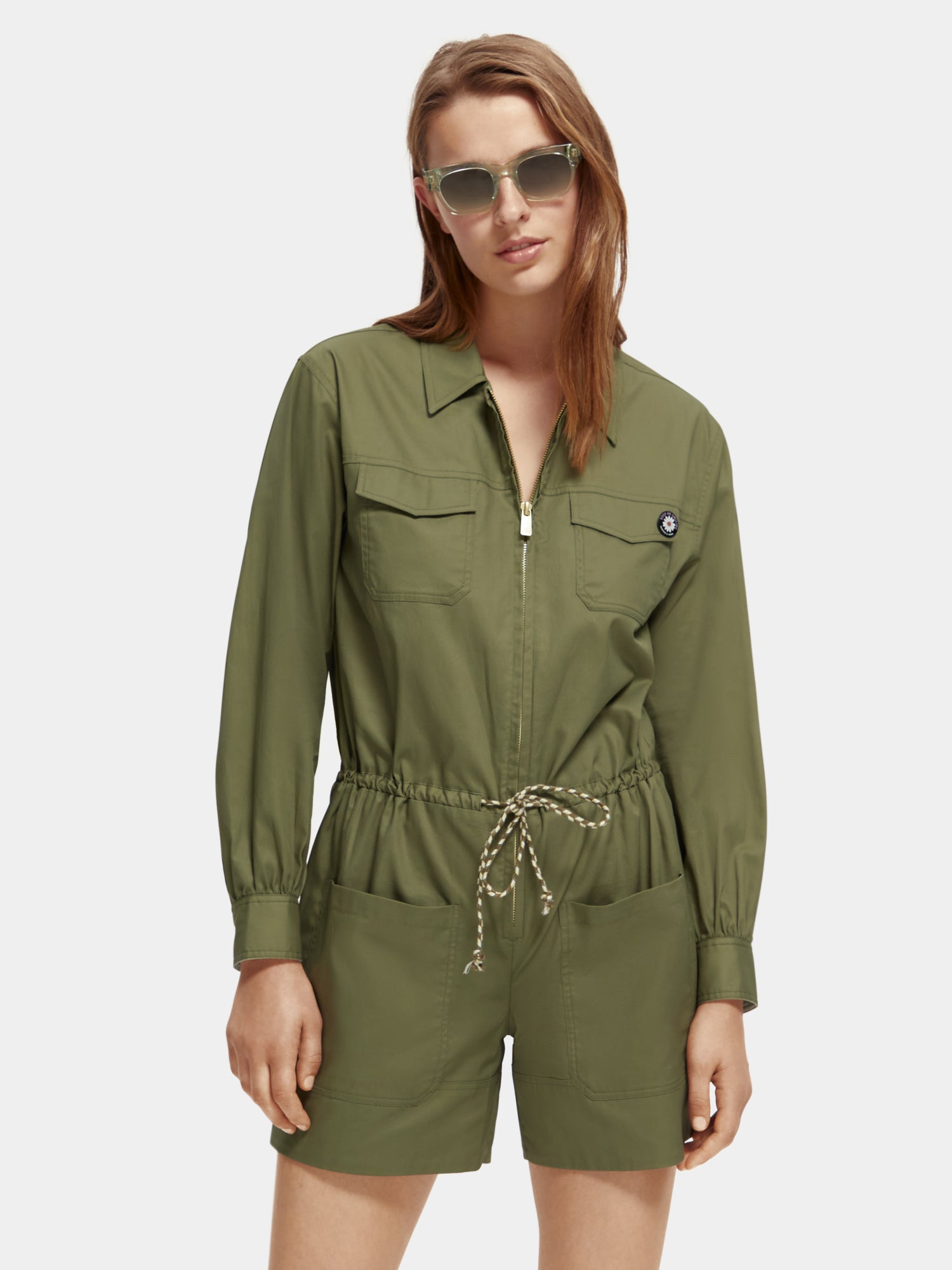 SCOTCH & SODA military playsuit jumpsuit with camo pattern, short sleeves, and button details, casual and stylish for everyday wear.