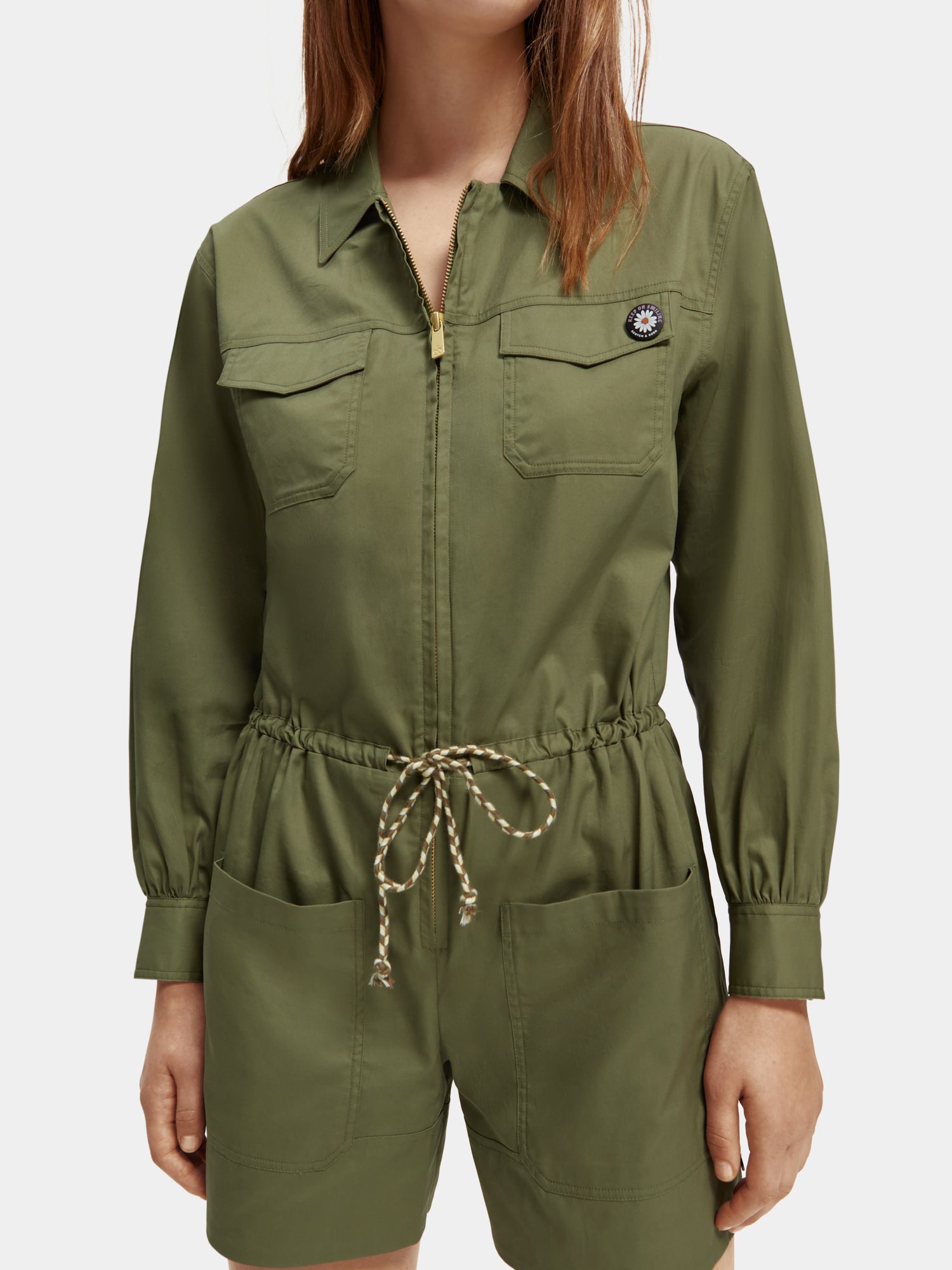 SCOTCH & SODA military playsuit jumpsuit with button details and camouflage pattern, shown on a model.