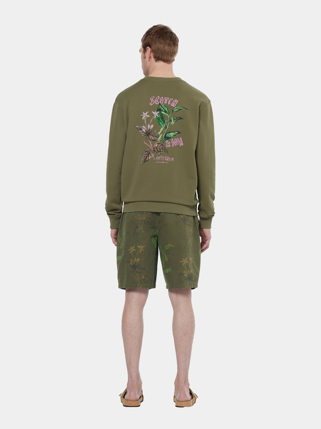 Printed shorts by Scotch & Soda featuring vibrant patterns and casual fit, displayed on a neutral background.