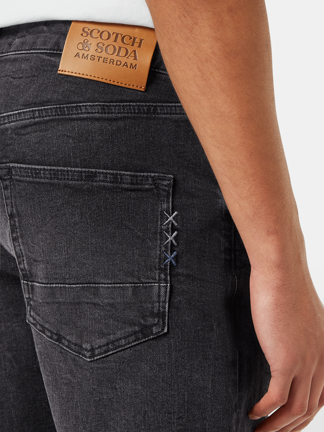 SCOTCH & SODA Ralston denim shorts with frayed hem and classic five-pocket design, displayed on a plain background.