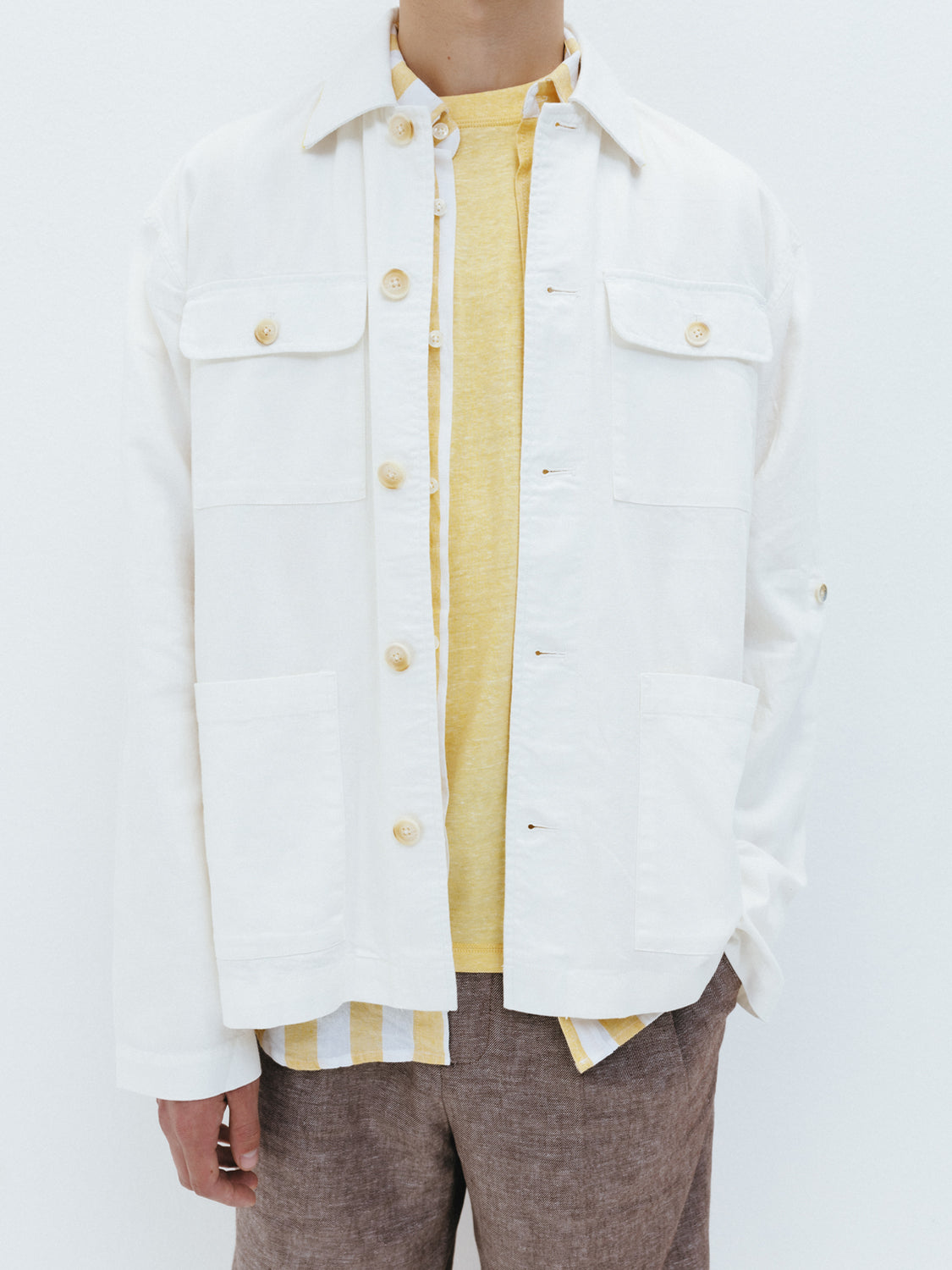 Cotton-linen overshirt jacket by Scotch & Soda featuring a casual fit and neutral fabric in a close-up image.