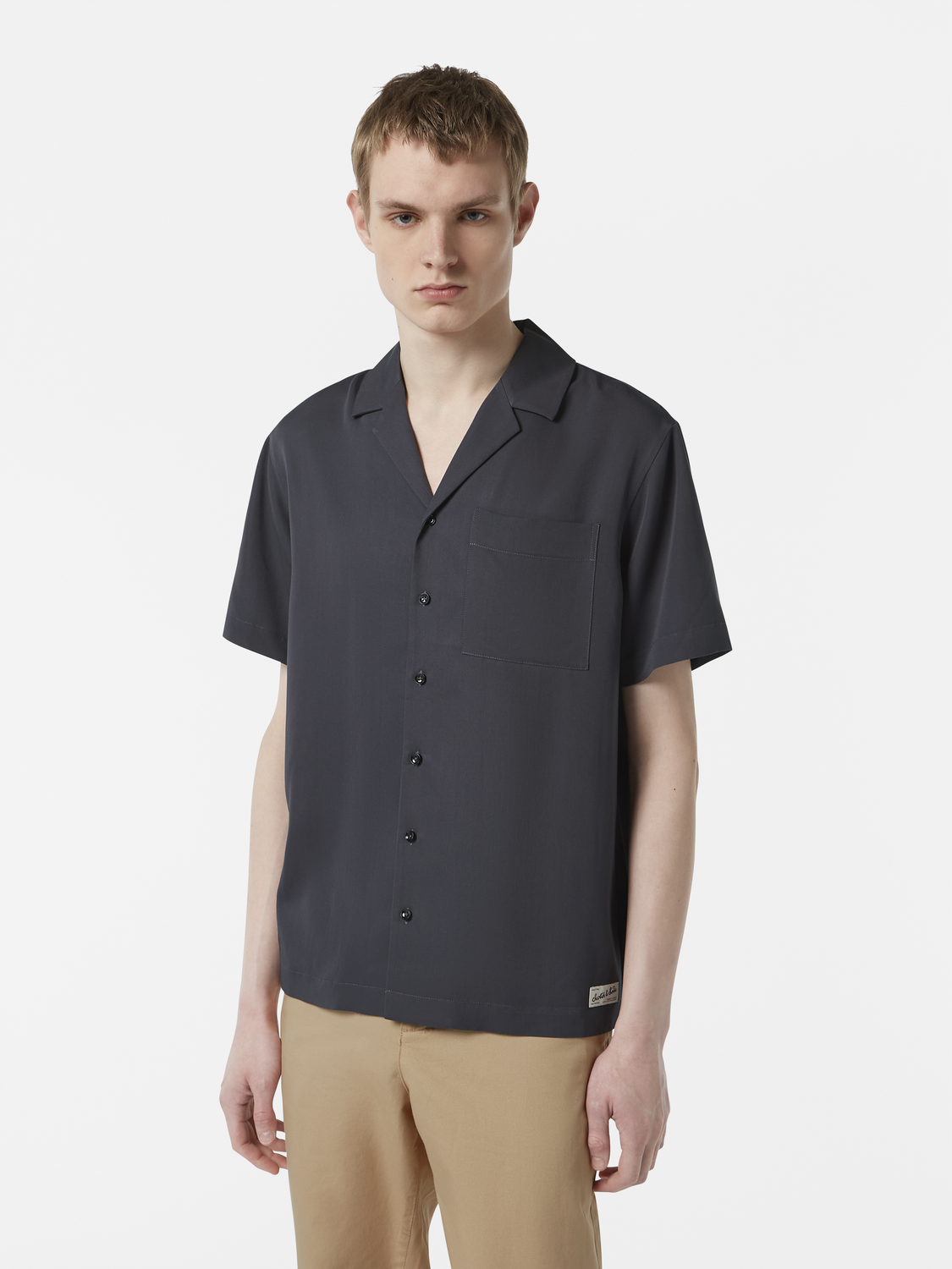 Light blue Scotch & Soda sateen short-sleeved shirt with a classic collar and smooth fabric, displayed on a hanger.