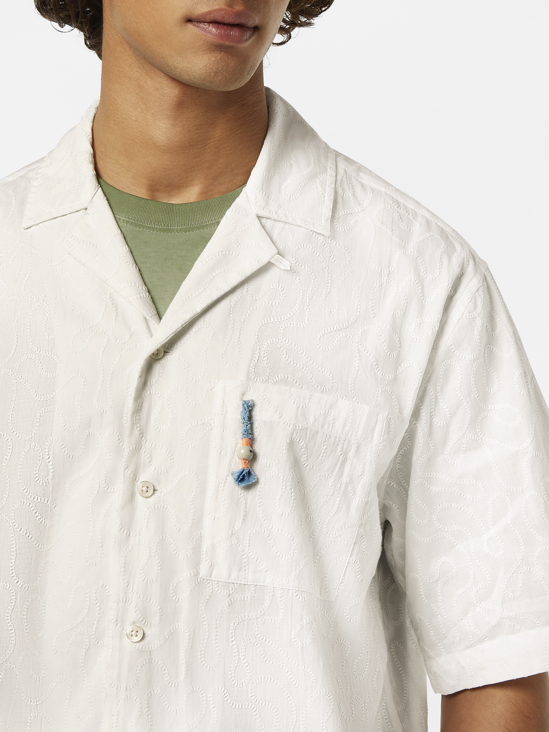 Embroidered short-sleeve shirt by Scotch & Soda featuring colorful floral embroidery on lightweight fabric.
