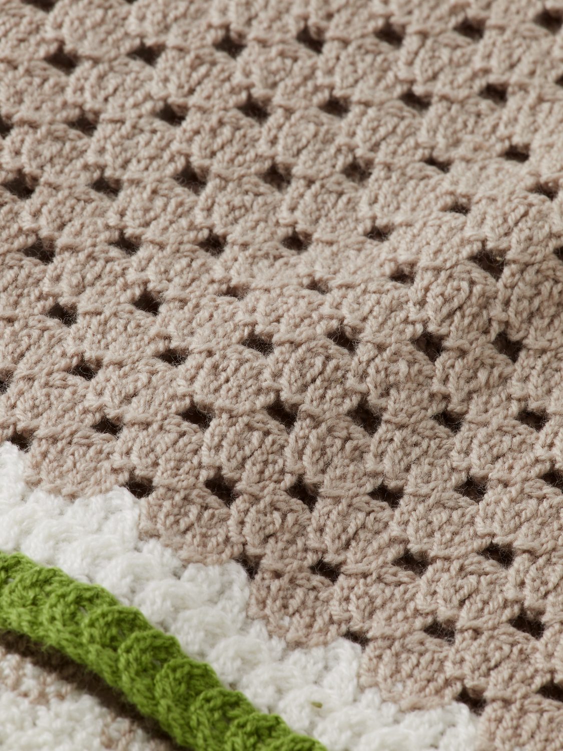 Crochet knitwear shirt by Scotch & Soda featuring intricate crochet patterns and a relaxed fit, displayed on a neutral background.