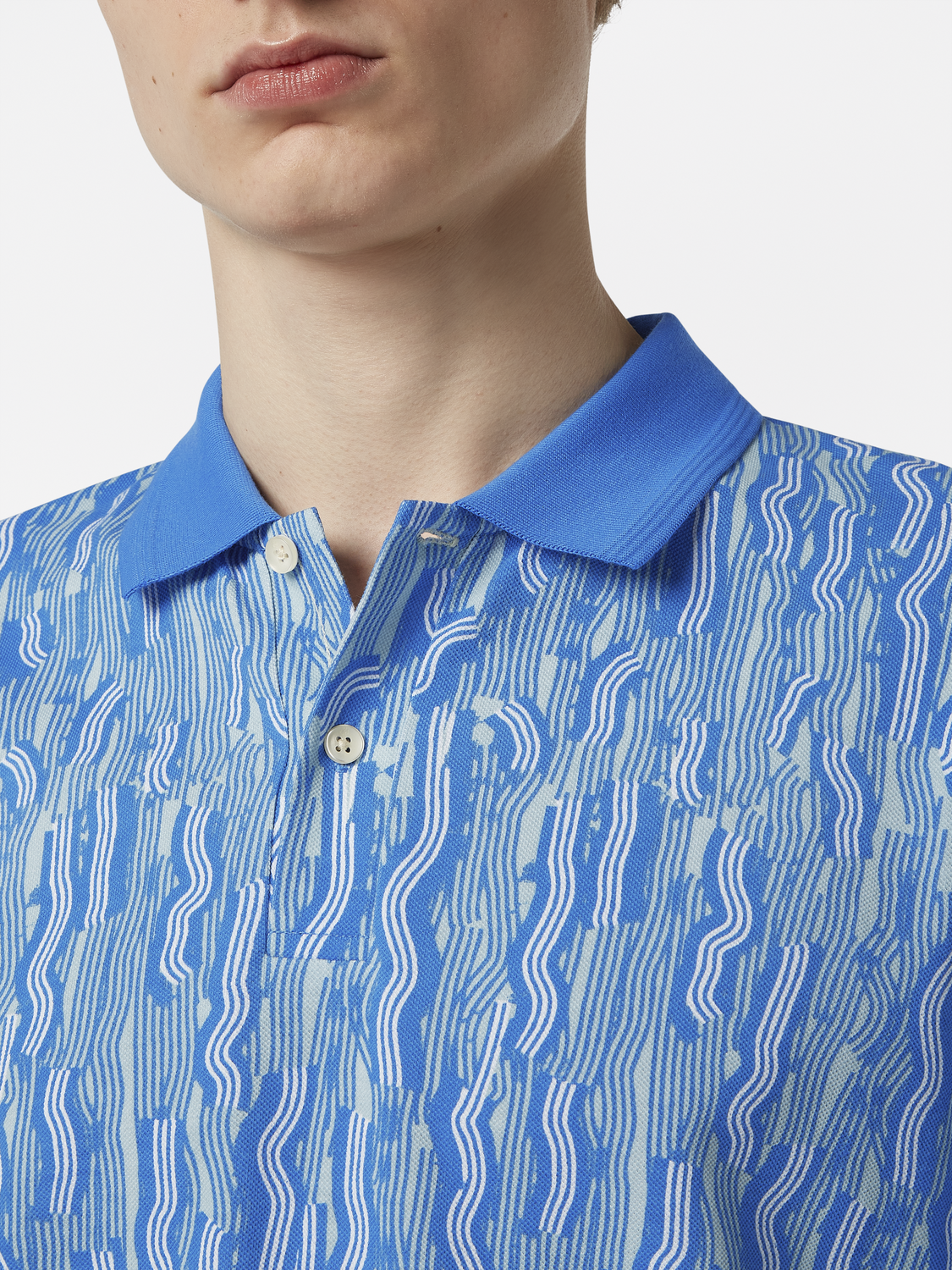 Printed Scotch & Soda polo shirt featuring a colorful pattern, short sleeves, and a classic collar for casual style.