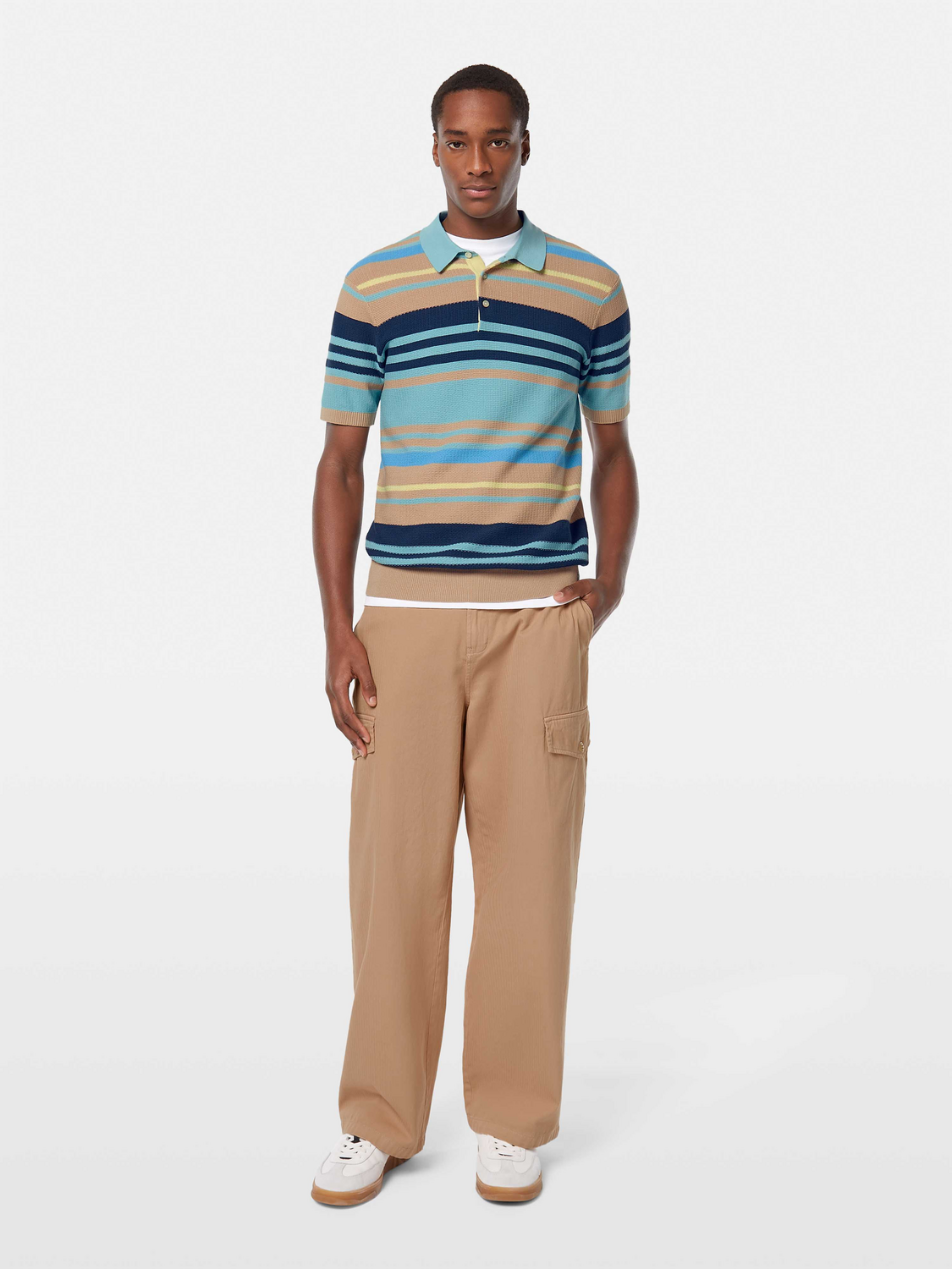 Dark blue knitted polo shirt from Scotch & Soda with a classic collar and short sleeves, displayed on a neutral background.
