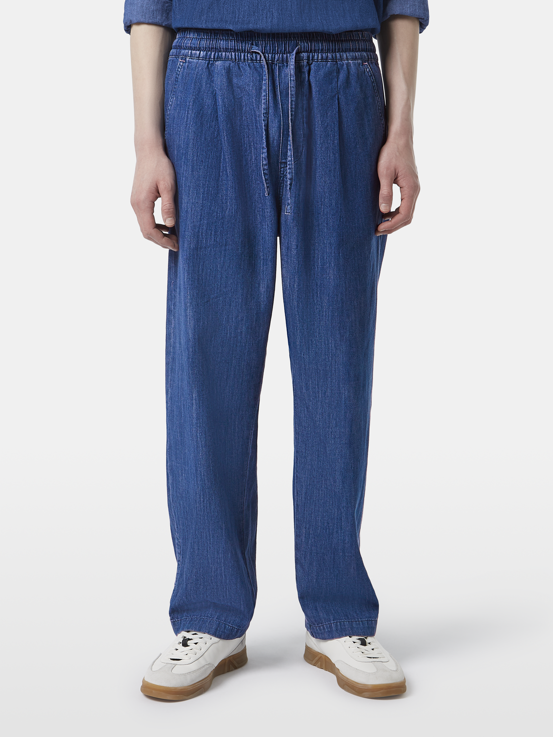 Lightweight denim pants by Scotch & Soda, featuring classic denim fabric and a relaxed fit, displayed on a neutral background.