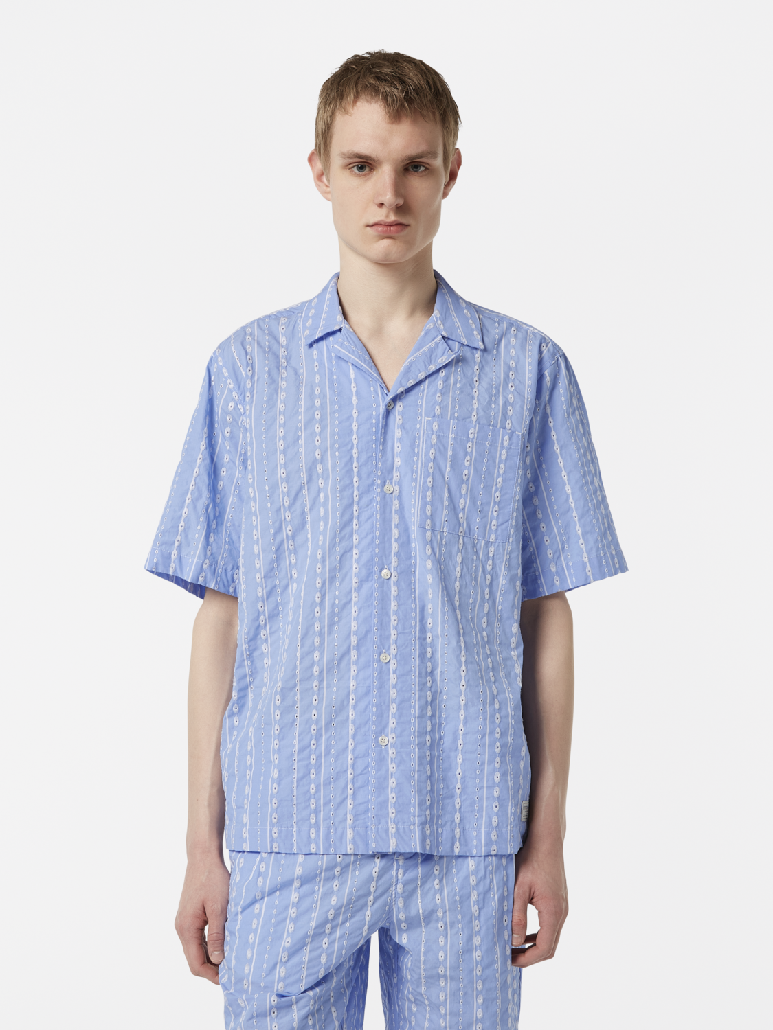Embroidered short-sleeve shirt by Scotch & Soda featuring colorful floral embroidery on light fabric.
