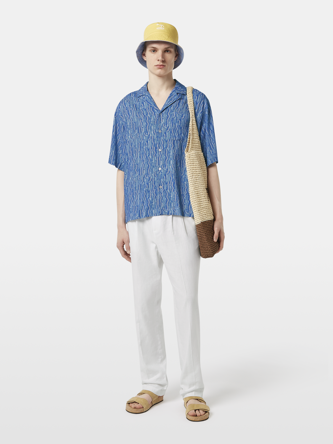 Short-sleeved printed shirt by Scotch & Soda with colorful floral design, casual fit, and button-up front.