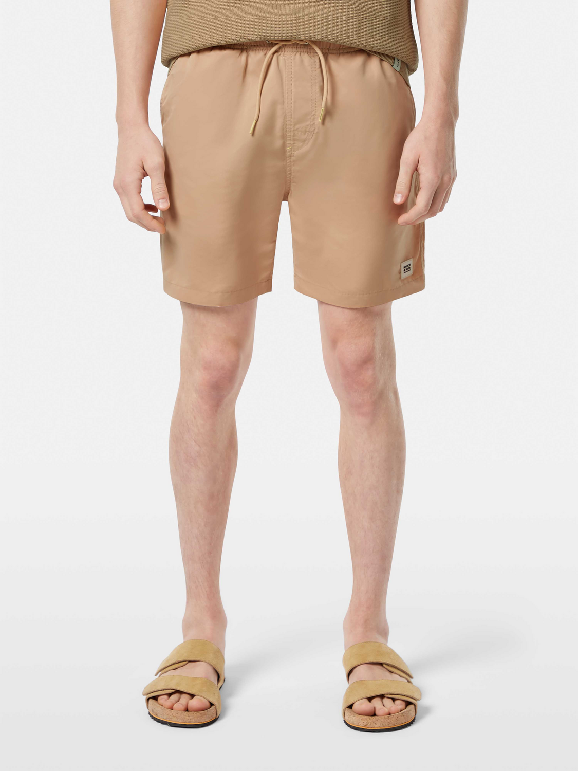 Mid-length Scotch & Soda swim shorts in vibrant print, featuring an elastic waistband and casual fit for beach or poolside wear.