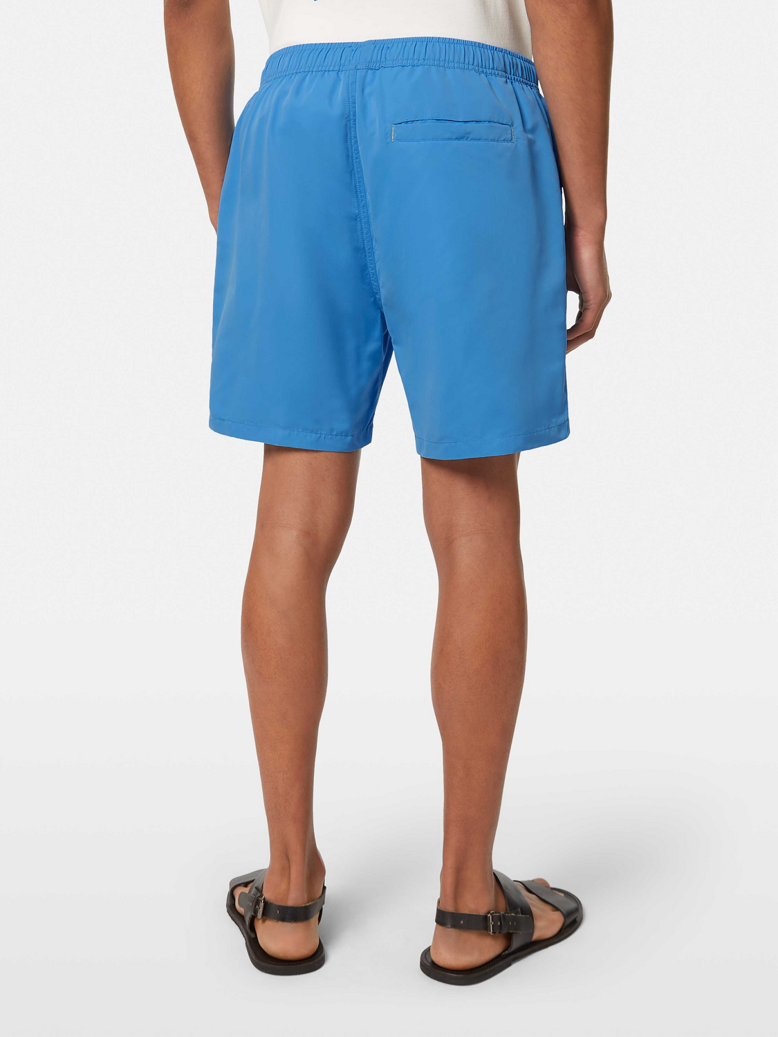Mid-length Scotch & Soda swim shorts in vibrant coral color with an elastic waistband, displayed from the back.