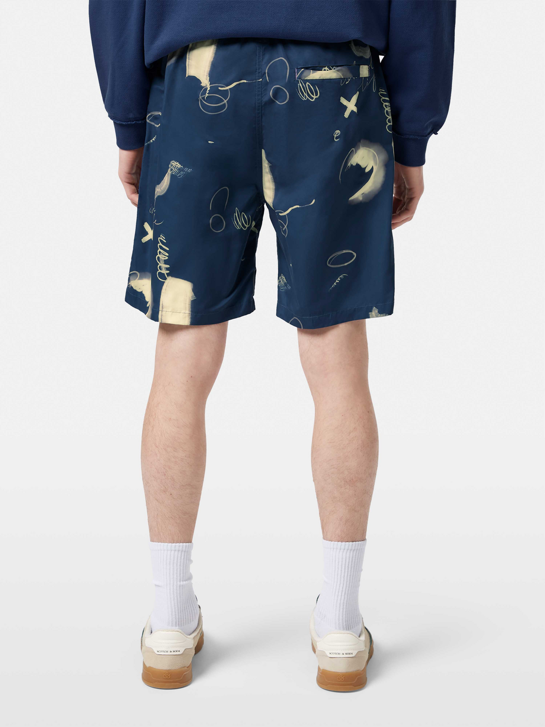 Printed SCOTCH & SODA swimshorts with a colorful pattern, displayed from the back showing the design and fit.