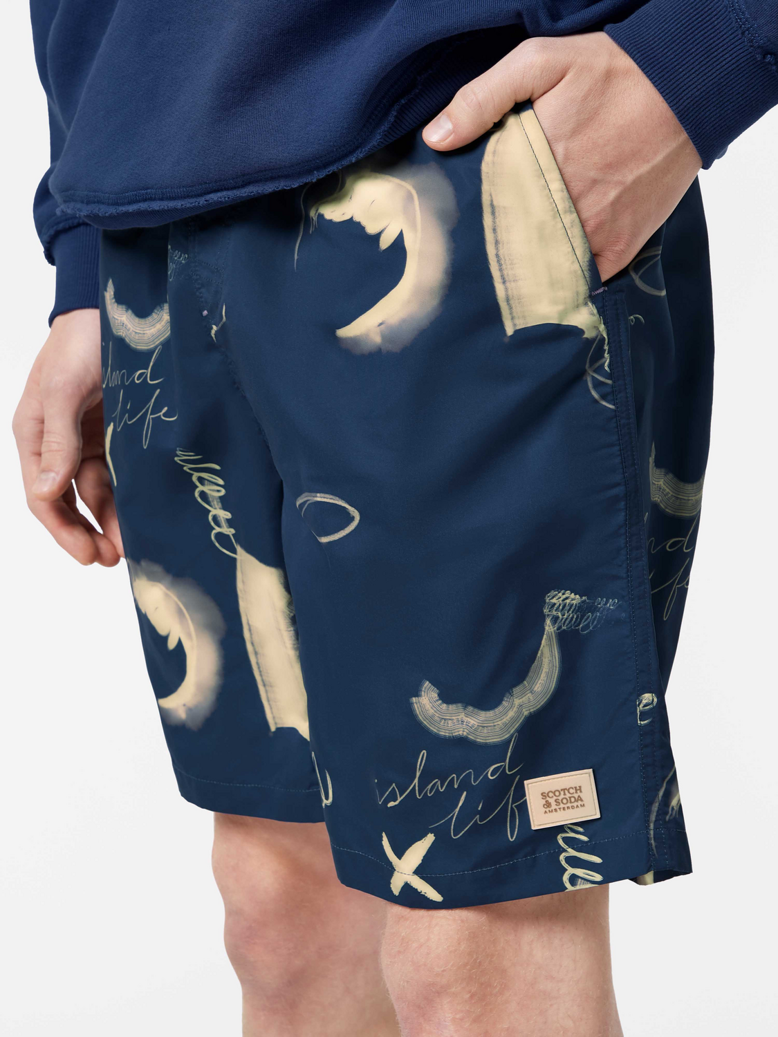 Printed Scotch & Soda swimshorts with colorful tropical pattern, lightweight swimwear for men.