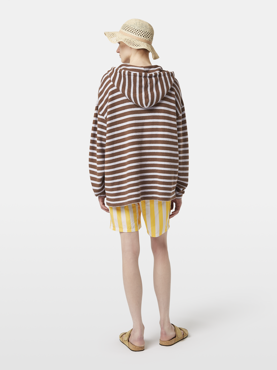 Striped terry hoodie from Scotch & Soda, showing the back view with colorful horizontal stripes and a relaxed fit.