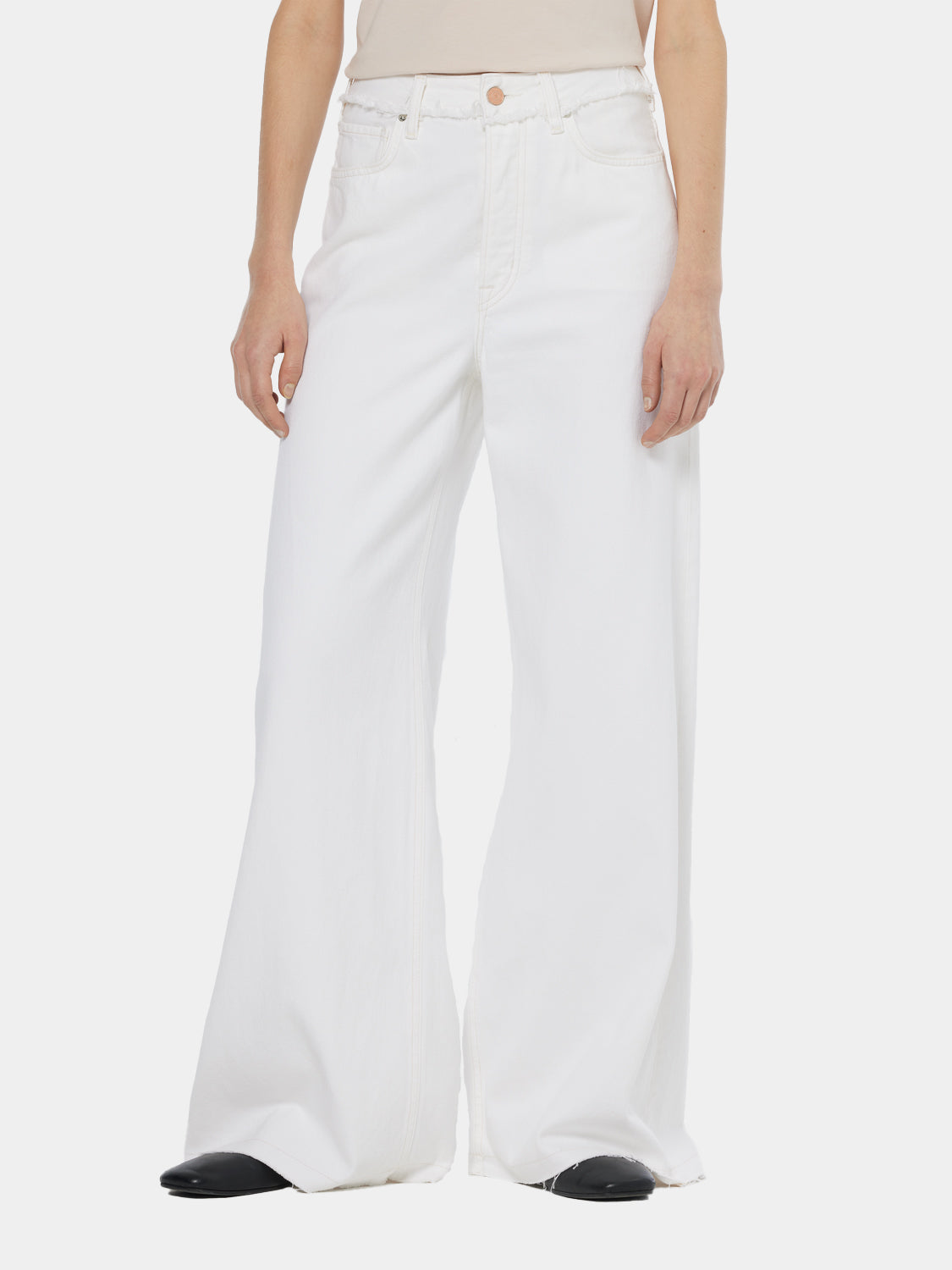 Scotch & Soda Wave wide-fit denim jeans with distressed details and classic five-pocket design on model.
