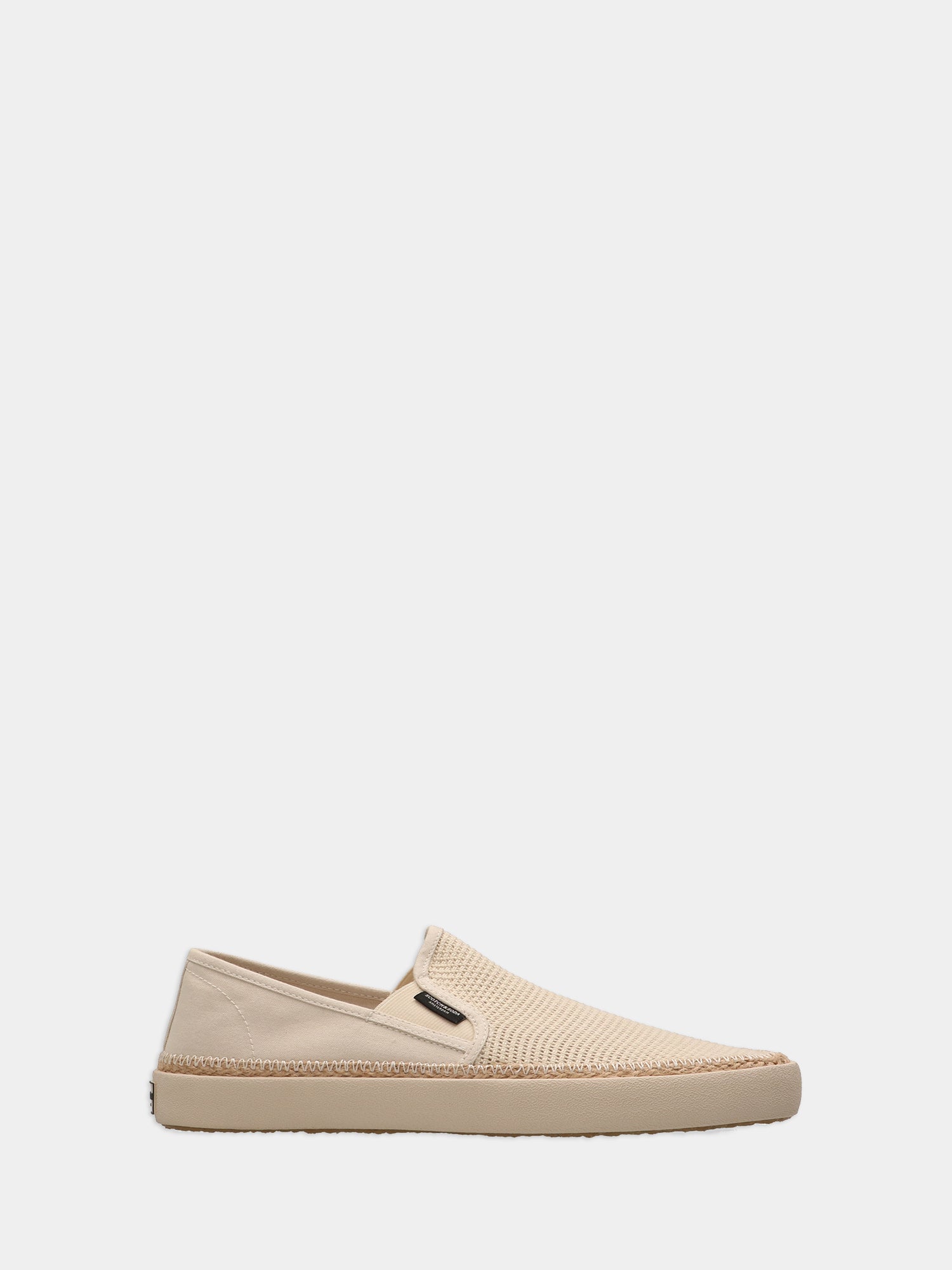 SCOTCH & SODA Izomi slip-on shoes on a neutral background, showcasing their casual footwear design and sleek silhouette.