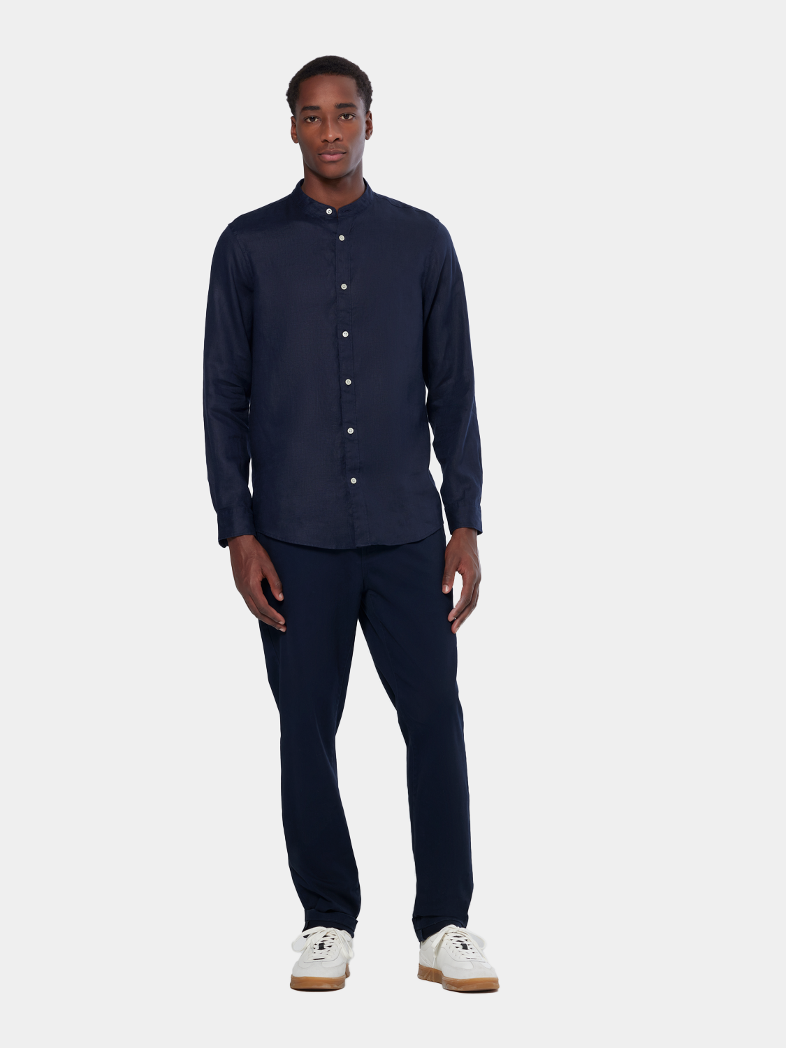 Long-sleeve collarless linen shirt by Scotch & Soda, shown in a neutral color with a relaxed fit and lightweight fabric.