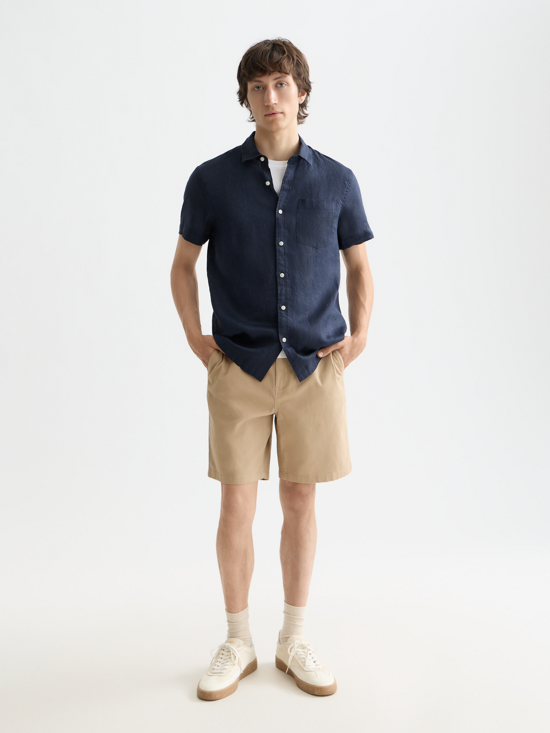 Light beige Scotch & Soda short-sleeved linen shirt displayed flat with collar and button details, ideal for warm weather.