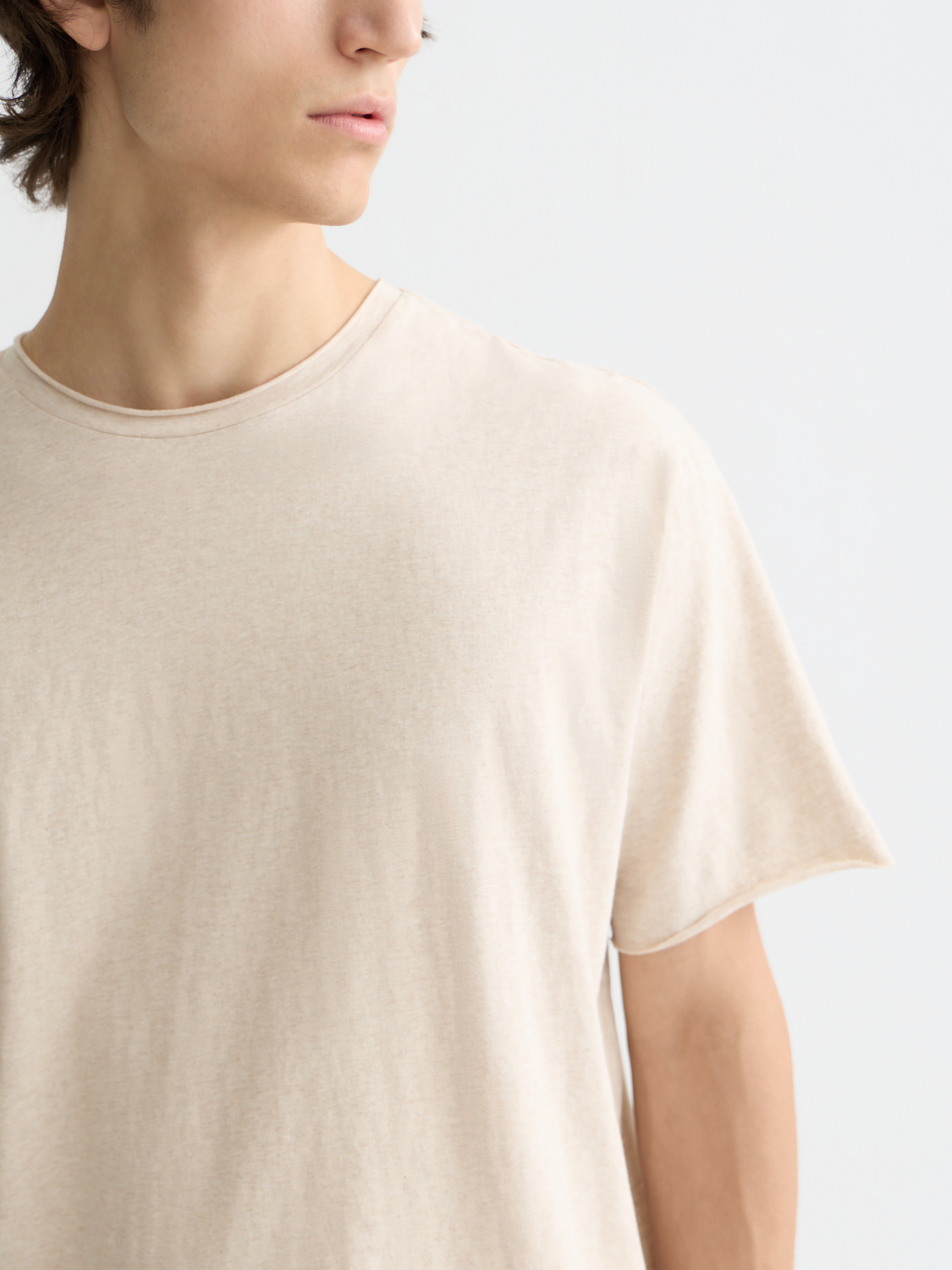 Raw-edged Scotch & Soda short sleeve t-shirt displayed flat with visible distressed hem and soft cotton fabric.