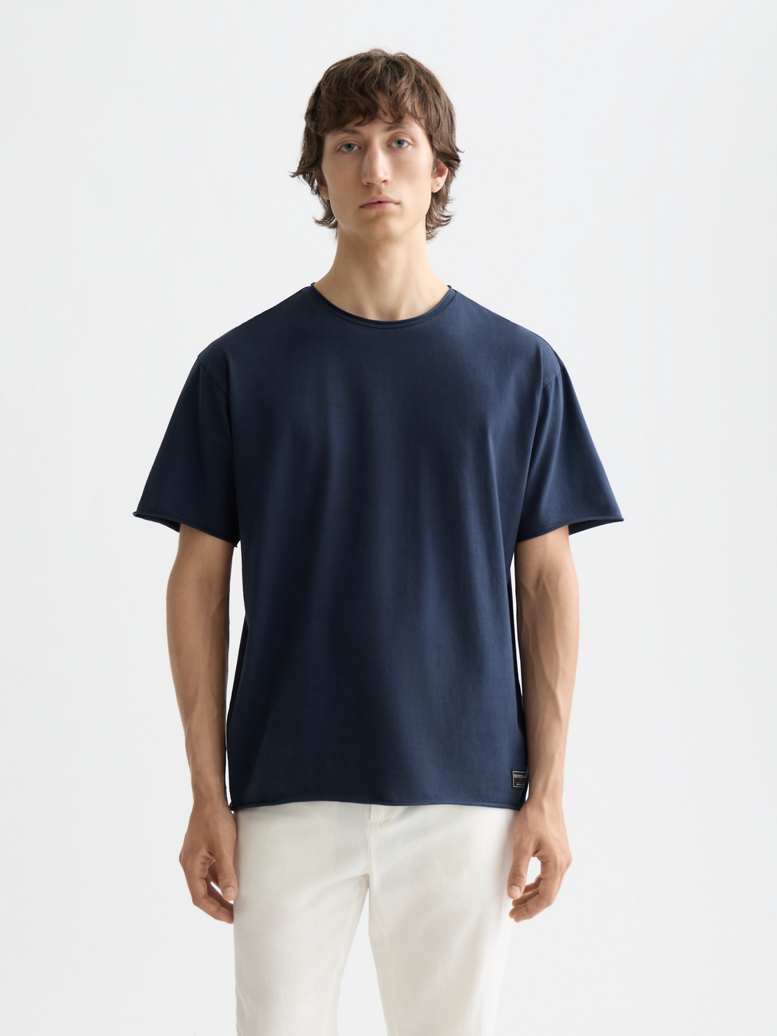 Raw-edged SCOTCH & SODA short-sleeve t-shirt with a casual fit, shown in a front view with a relaxed, stylish design.