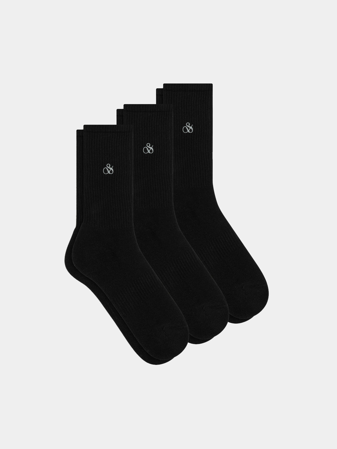 Three pairs of Scotch & Soda crew socks in various colors, shown flat with ribbed cuffs and soft fabric texture.