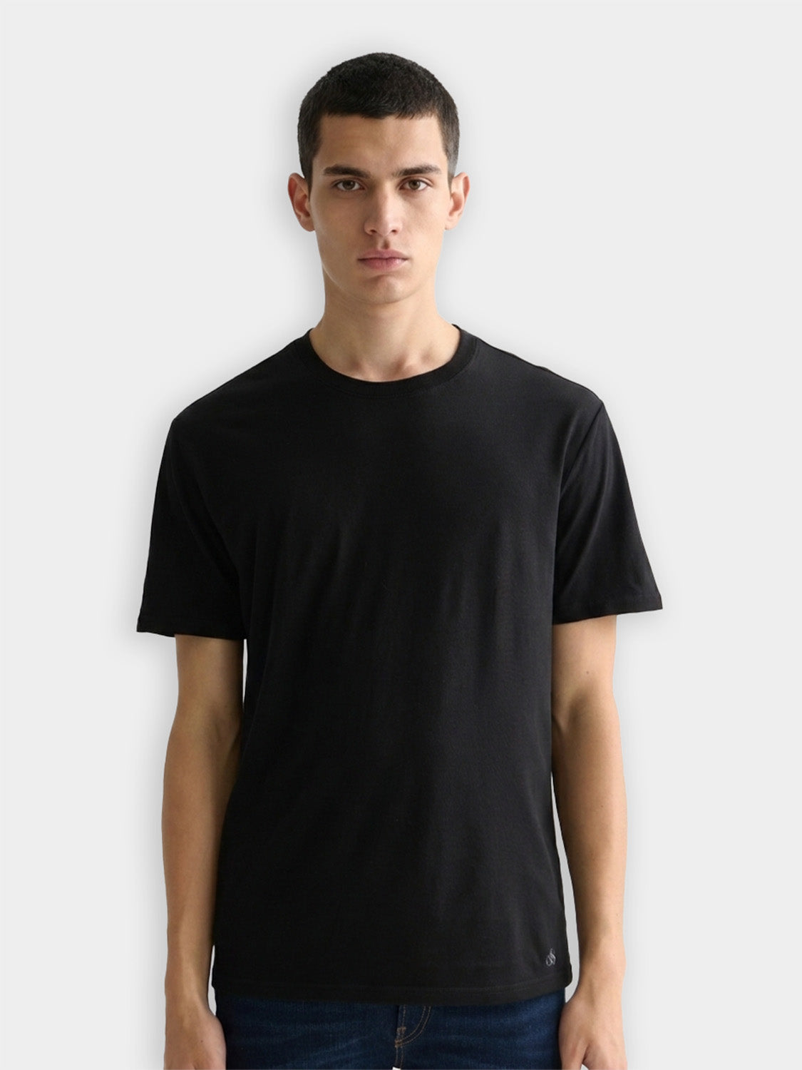 Three Scotch & Soda crew neck short sleeve T-shirts in neutral colors, displayed flat with folded collars and sleeves.