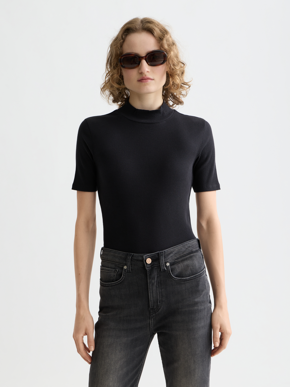 Light beige Scotch & Soda ribbed mock neck short-sleeve tee showing close-up of fabric texture and mock neckline detail.