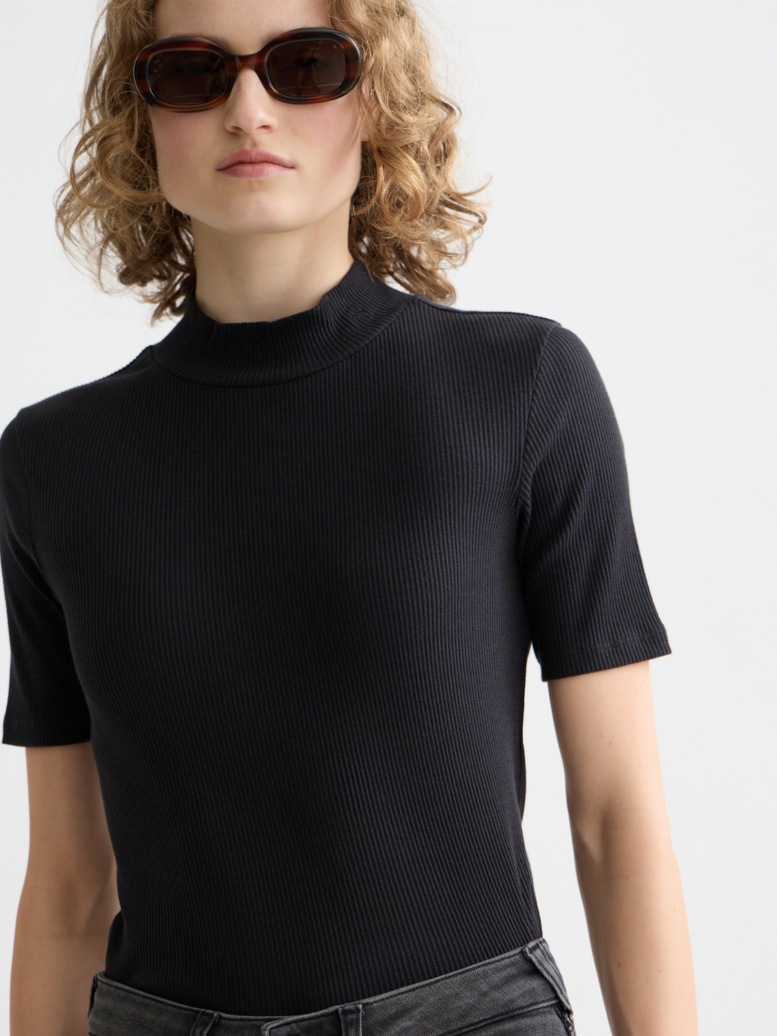 Light beige Scotch & Soda ribbed mock neck short-sleeve tee with a fitted silhouette and textured fabric.