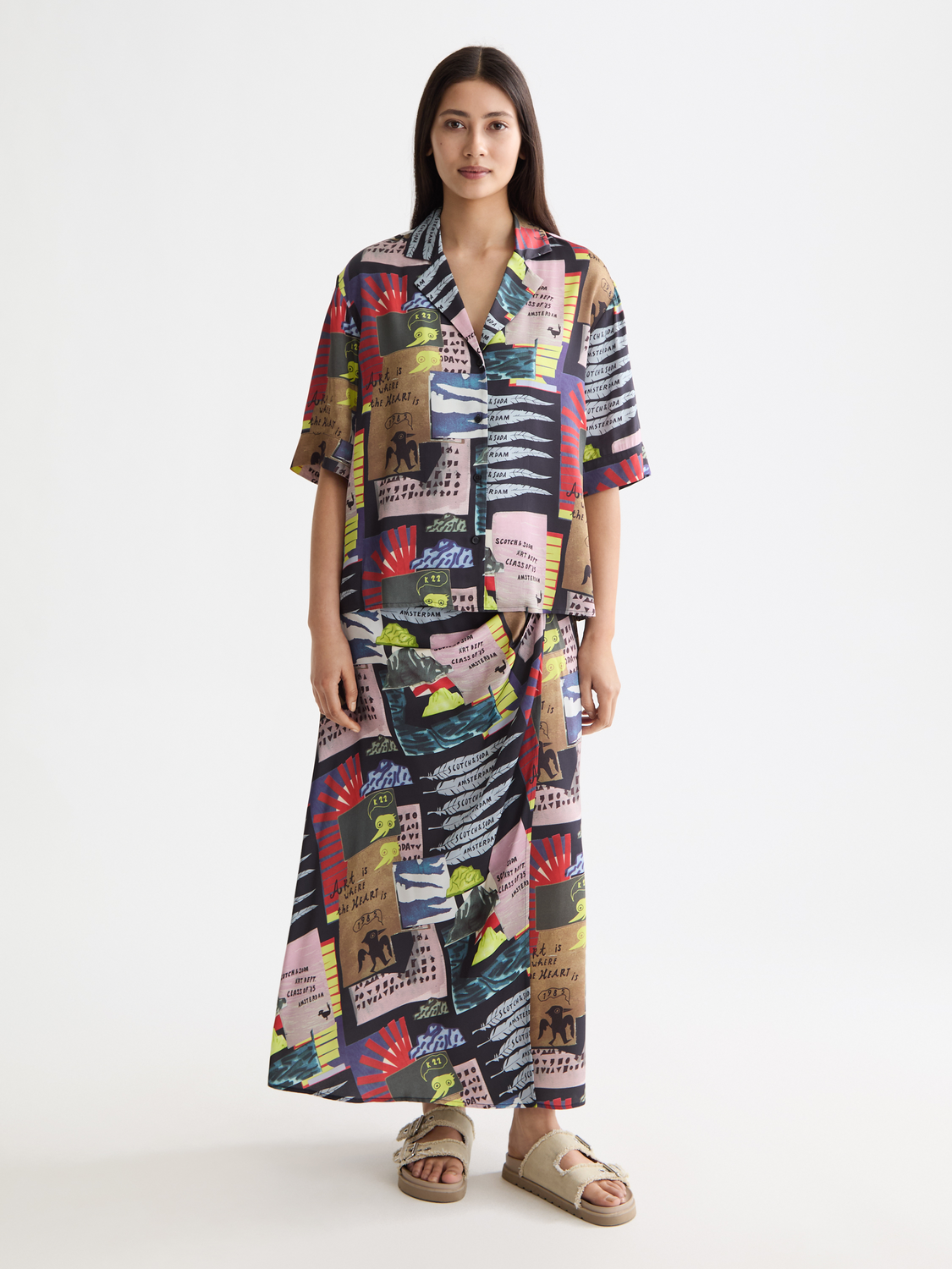 Printed short-sleeved shirt from Scotch & Soda featuring vibrant patterns and a classic fit, displayed on a model.