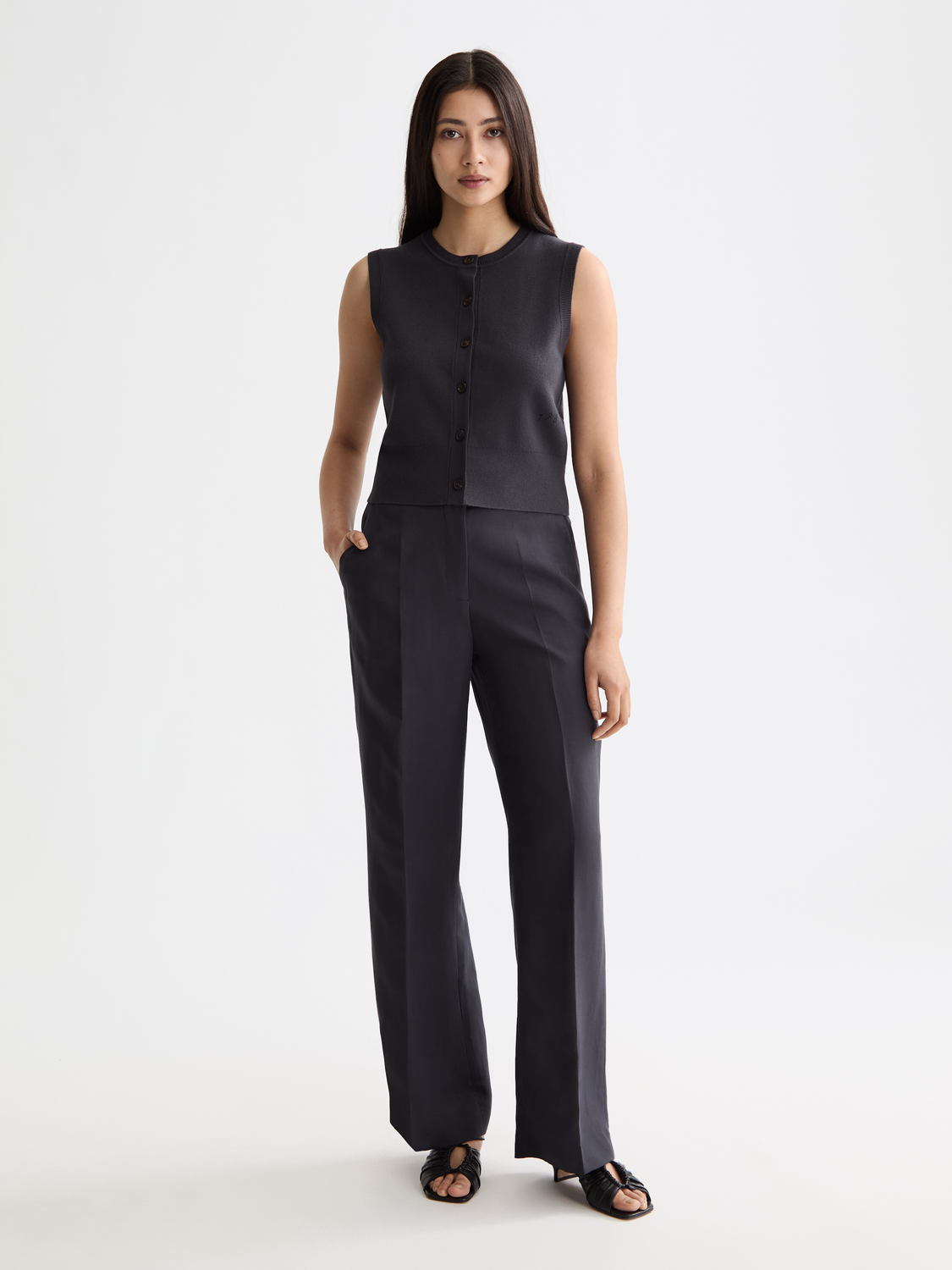 Knitted spencer top by Scotch & Soda, featuring a cozy knitwear design with a fitted silhouette and ribbed details.