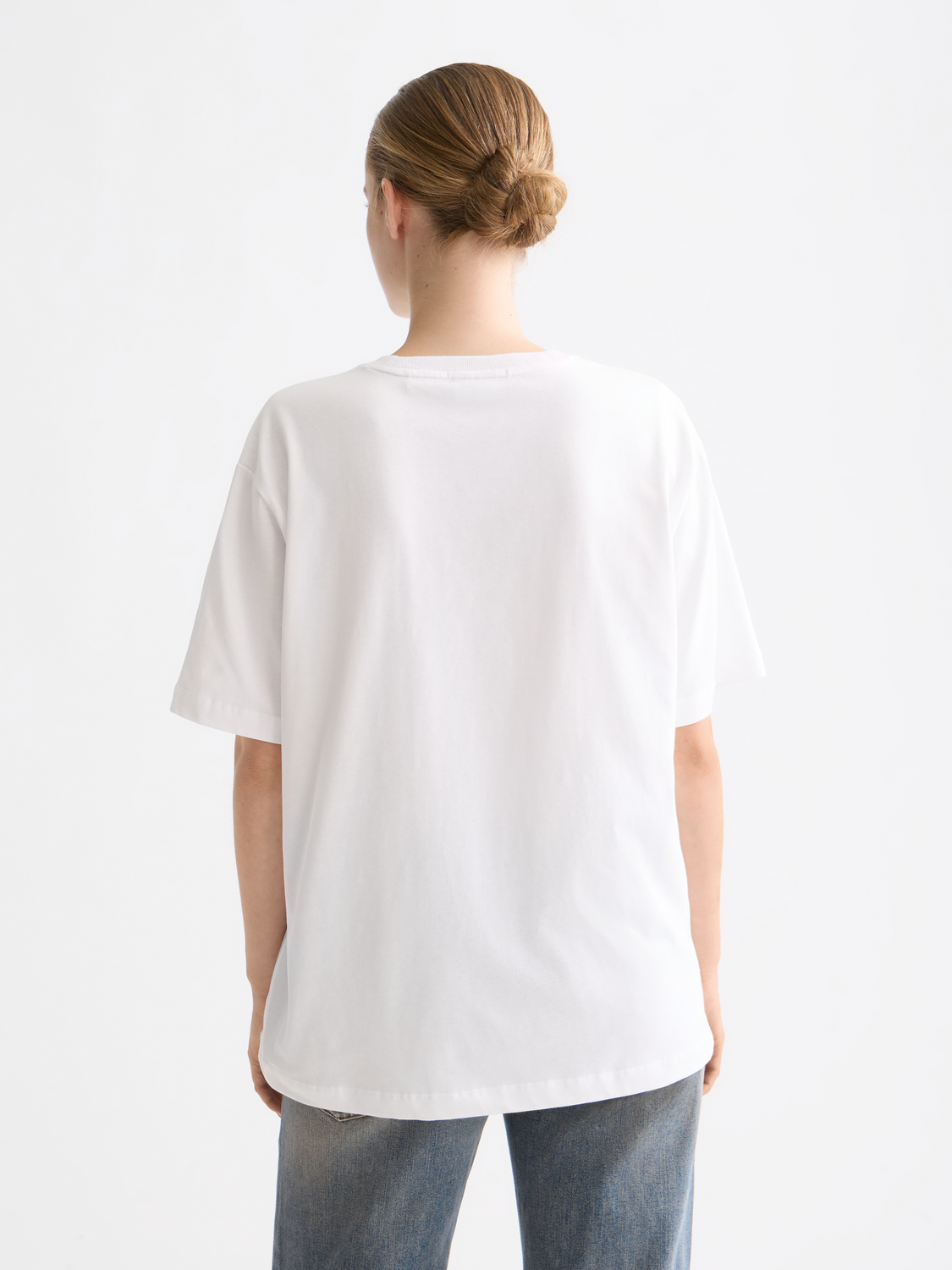 Black short-sleeve Scotch & Soda artwork t-shirt featuring a colorful printed design on the front.