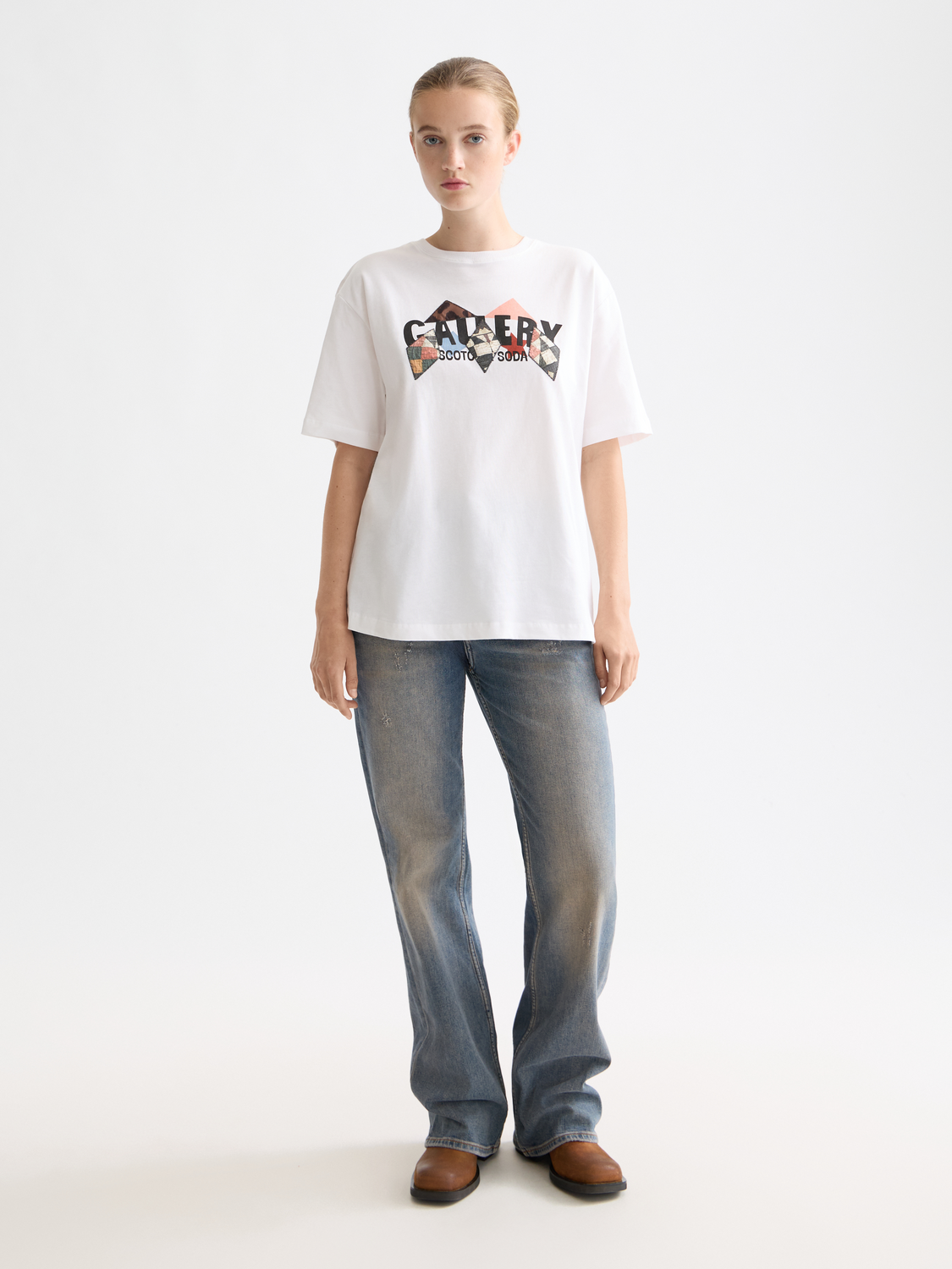 Front view of a Scotch & Soda short-sleeve artwork t-shirt featuring vibrant graphic design and casual fit.
