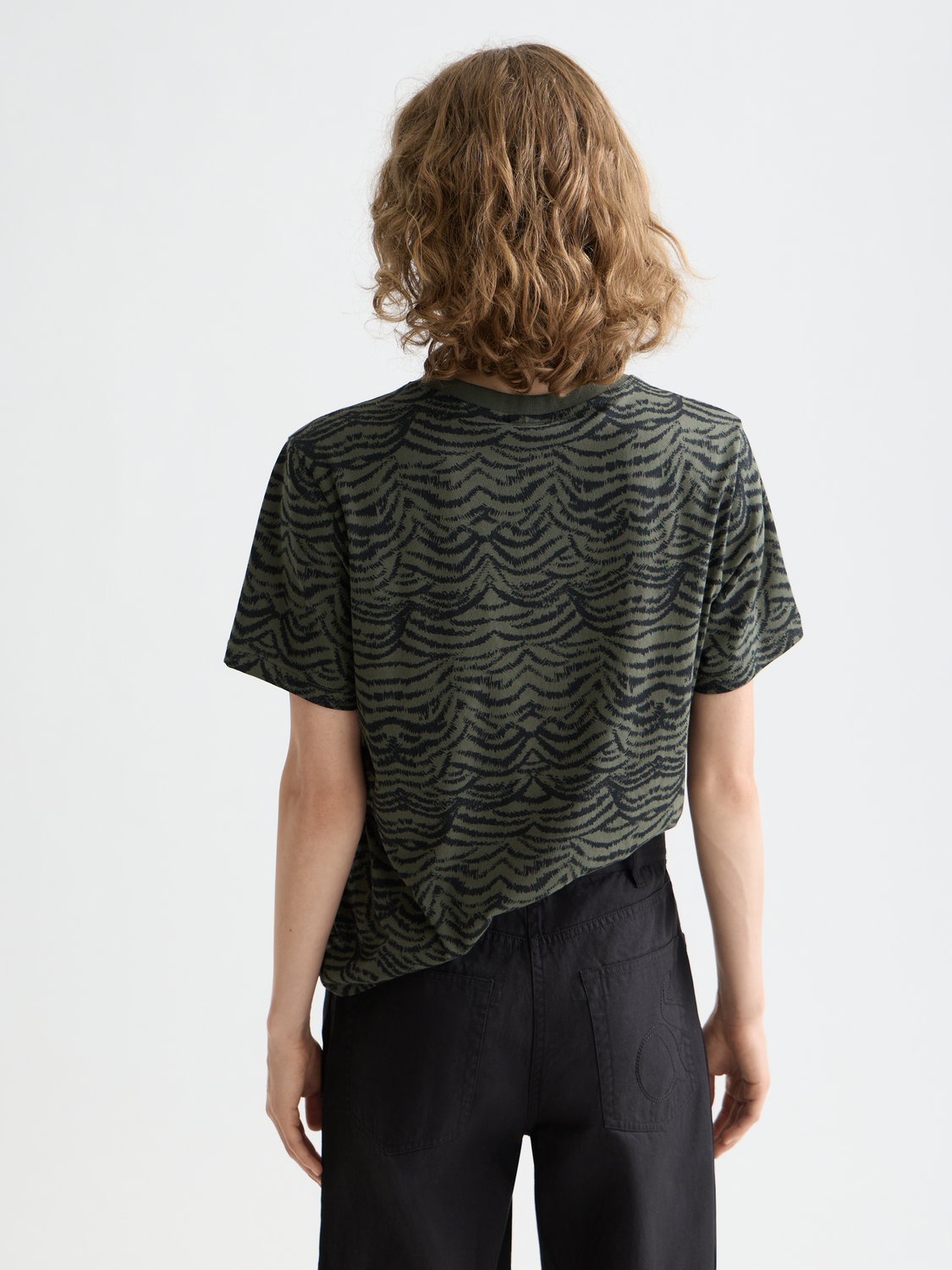 Black short-sleeve Scotch & Soda printed t-shirt with graphic design on the front.
