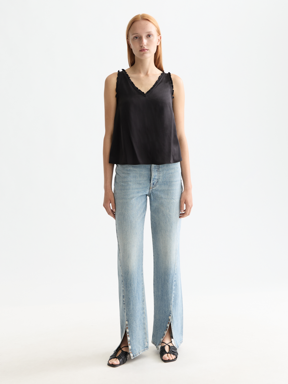 Scarlet V-neck ruffle tank top from Scotch & Soda with flowy ruffled sleeves and lightweight fabric.