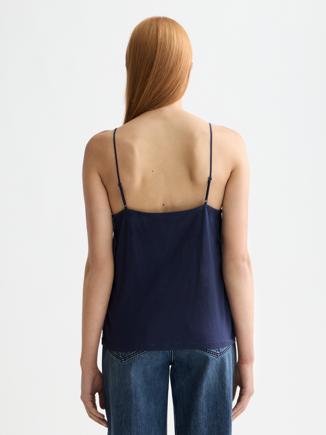 Black Scotch & Soda woven tank top with a sleeveless design and relaxed fit, showcased on a model.