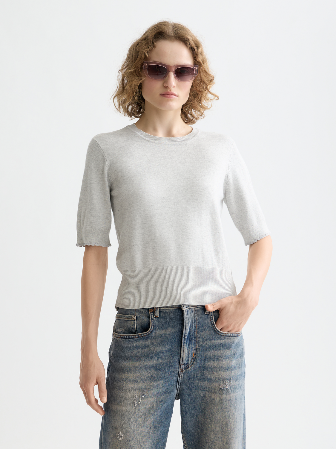 Short-sleeved knit pullover top by Scotch & Soda, featuring a casual fit and soft fabric in a neutral color.