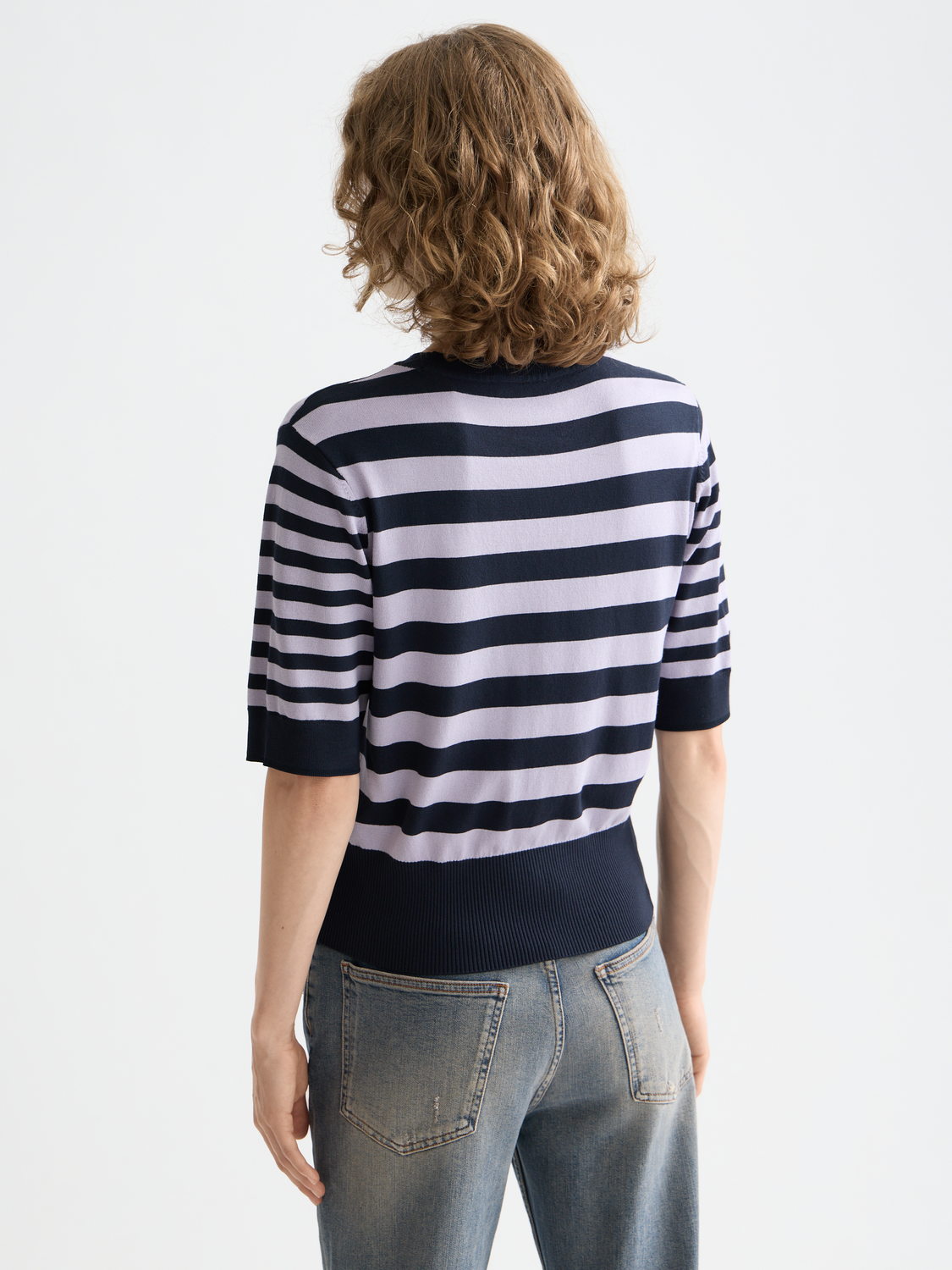 Black short-sleeved knit pullover top by Scotch & Soda, showcasing a cozy, stylish knitwear design.