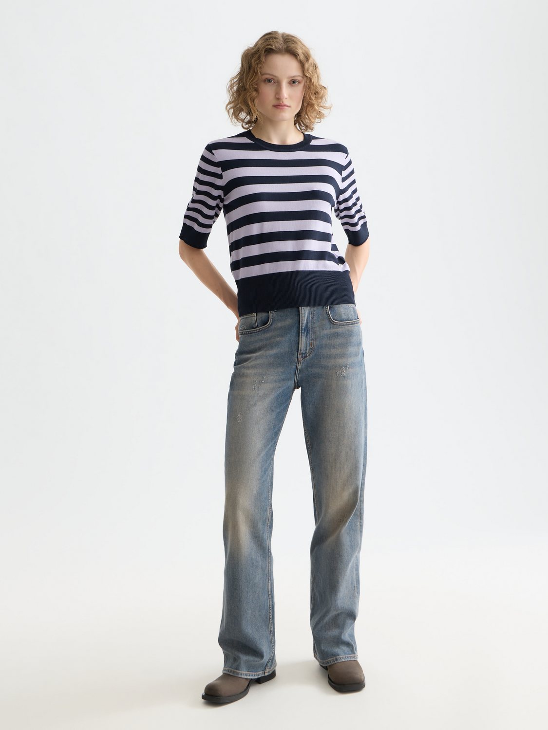 Short-sleeved knit pullover top by Scotch & Soda, featuring a stylish, fitted design with ribbed neckline and textured fabric.