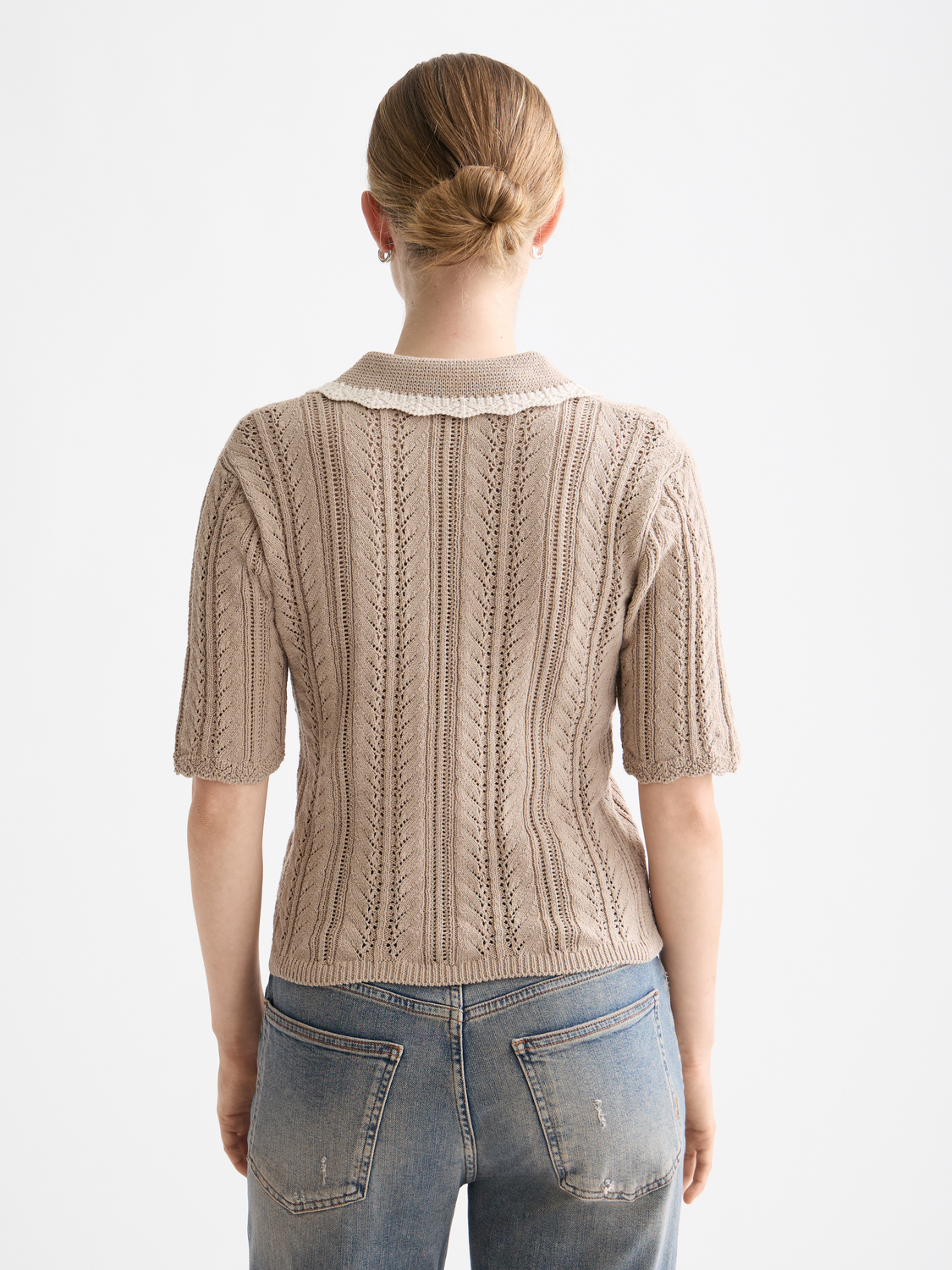 Pointelle collared polo knitwear by Scotch & Soda, featuring a soft fabric, button placket, and ribbed collar in a classic design.