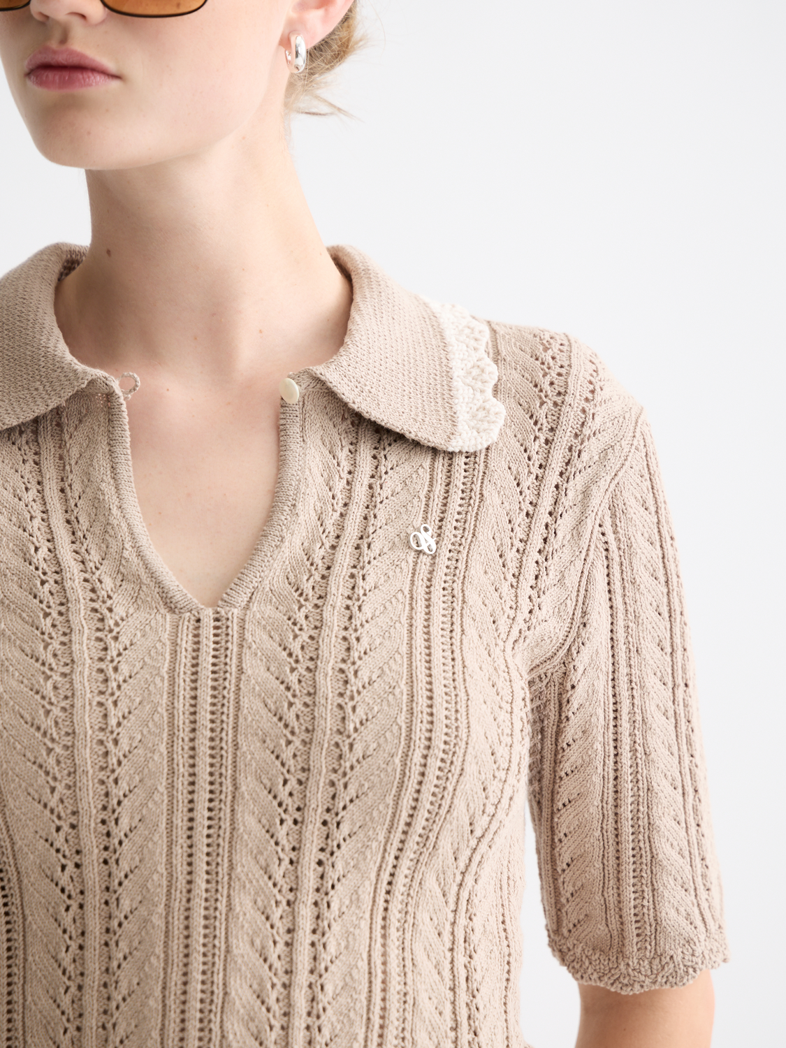 Pointelle collared knitwear polo by Scotch & Soda, featuring a classic design with a buttoned collar and textured fabric.