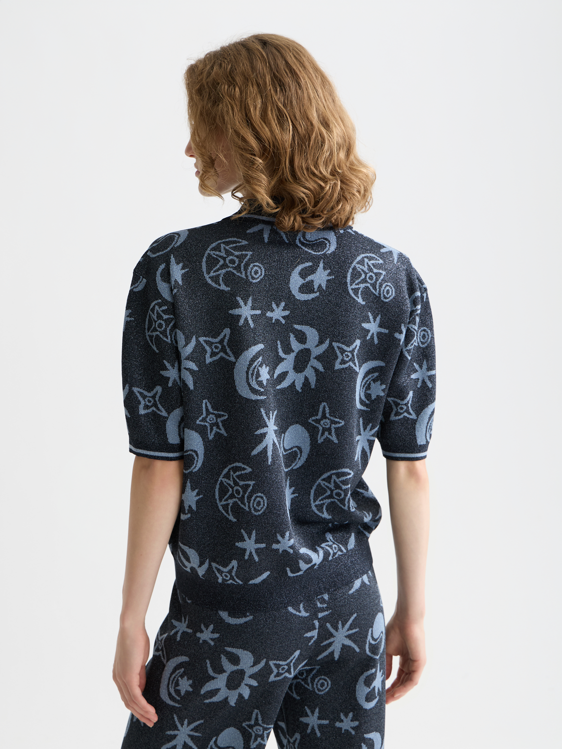 Scotch & Soda jacquard short sleeve knitwear pullover in a textured pattern, shown from the back in the image.