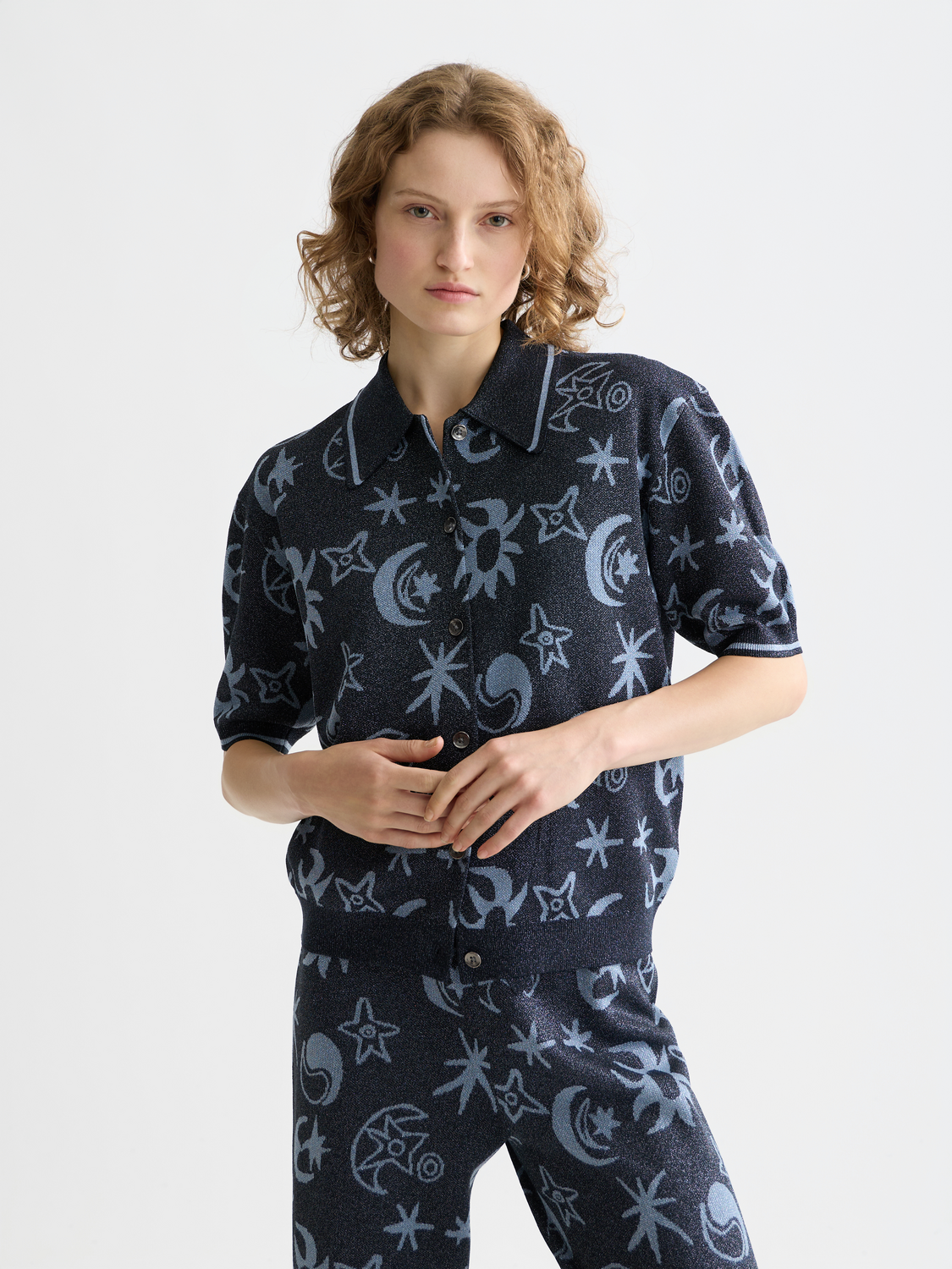 Scotch & Soda jacquard short sleeve knitwear pullover in a textured pattern, displayed flat with a neutral background.