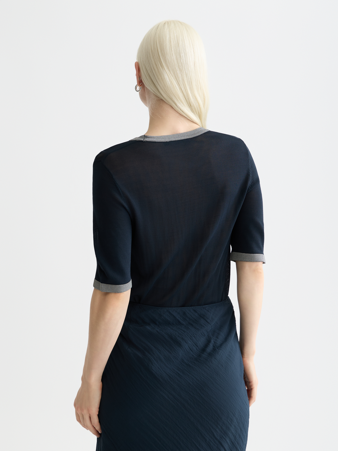 Blue short-sleeved knit pullover by Scotch & Soda, shown from the back with textured knit fabric and relaxed fit.